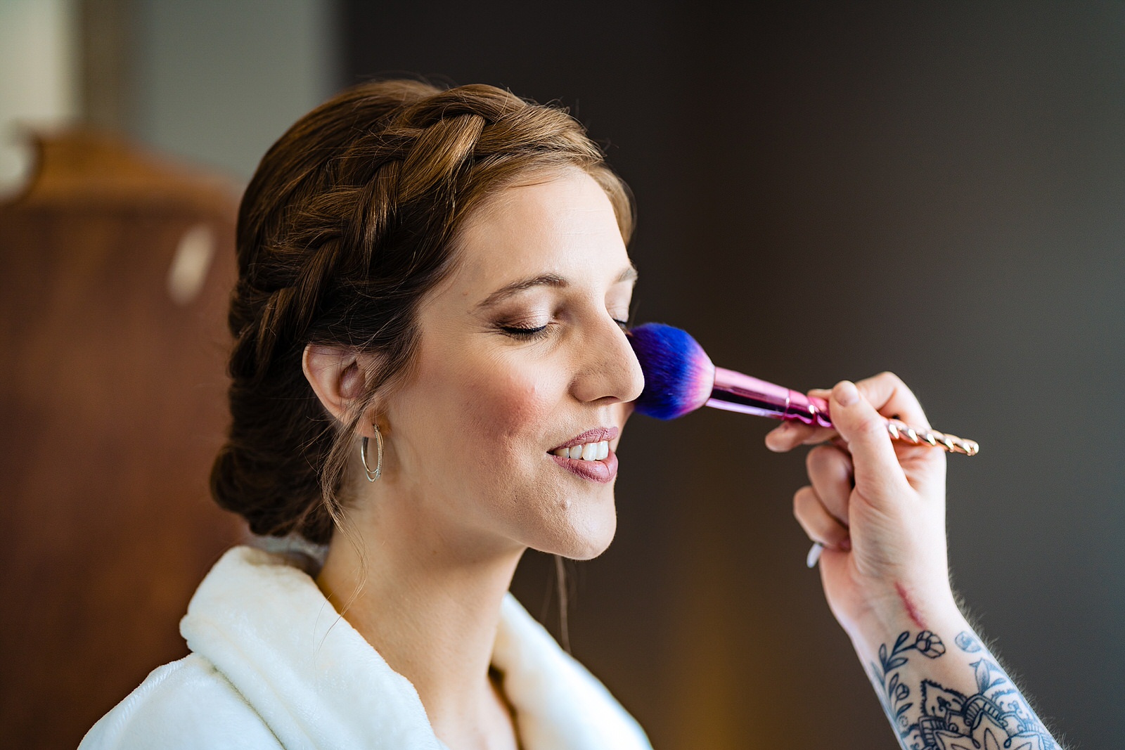 Bride has her makeup done at the Meadows Raleigh by Raleigh wedding photographers