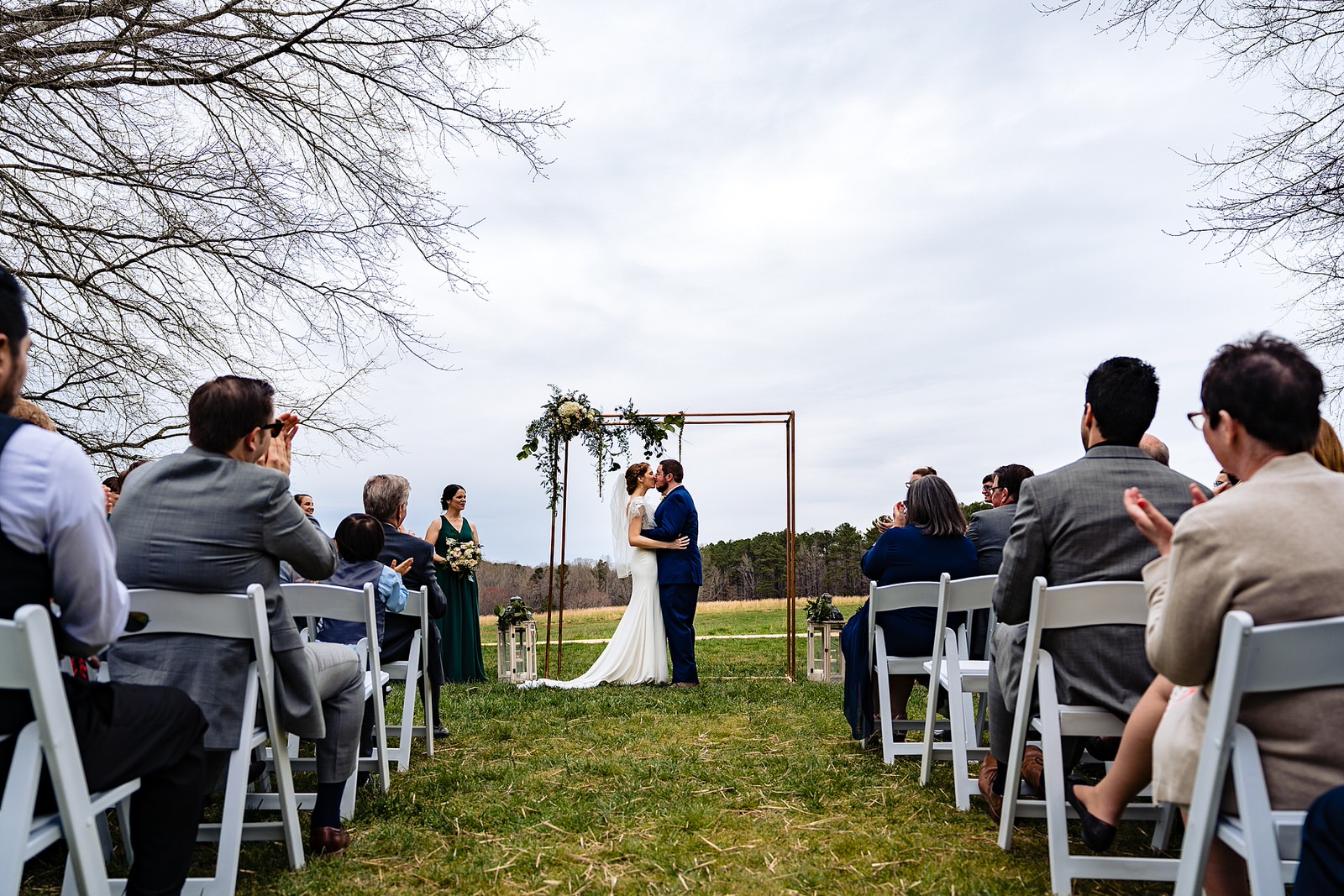 Outdoor wedding ceremony at The Meadows Raleigh by Raleigh wedding photographers