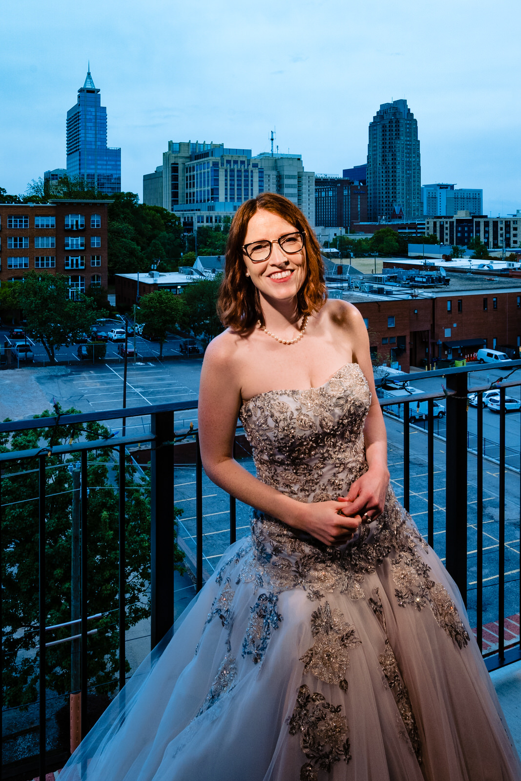 bride on her balcony in downtown raleigh, part of the big fake quarantine wedding project