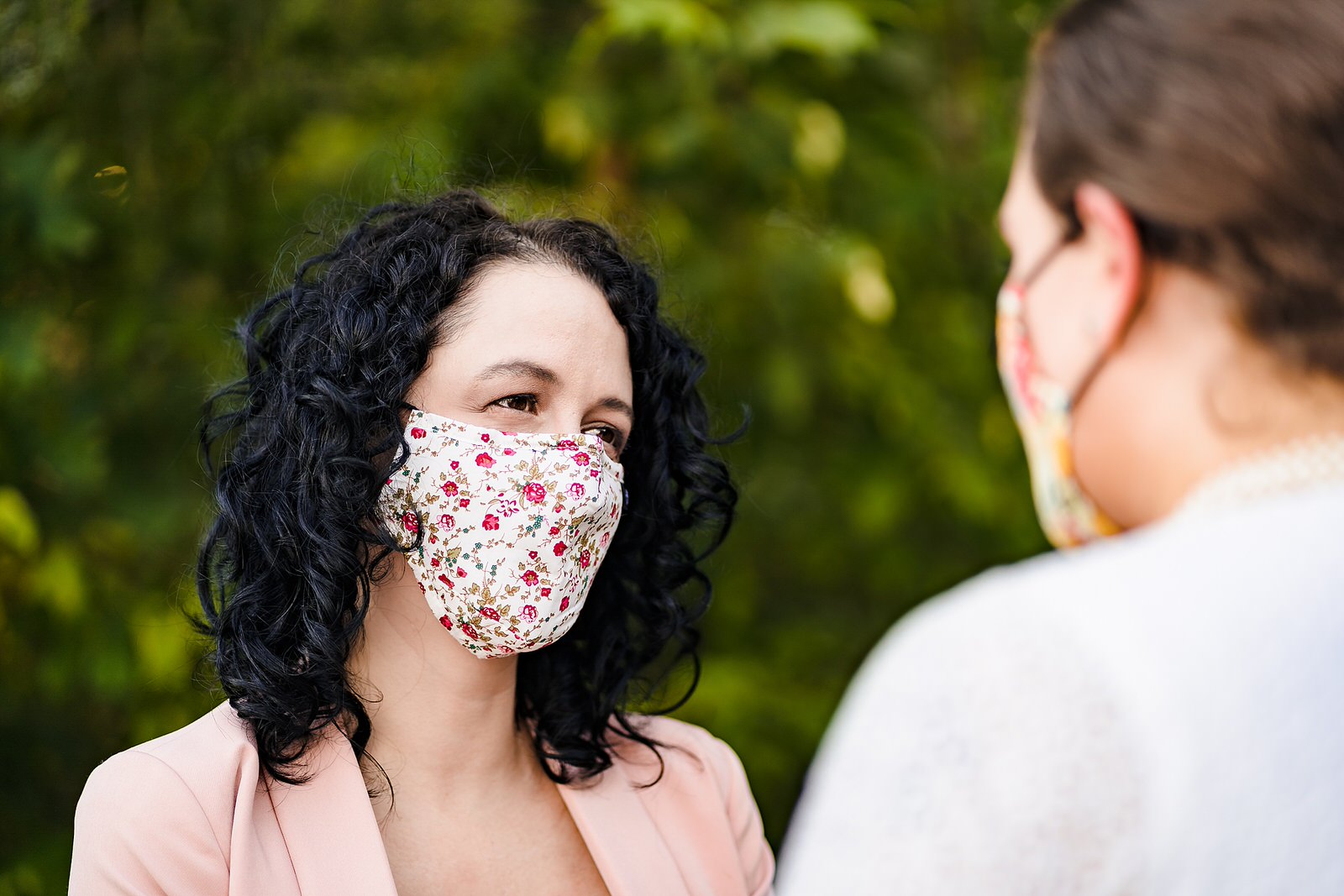 Bride wears a mask during an intimate elopement wedding after their big wedding was postponed due to Covid19