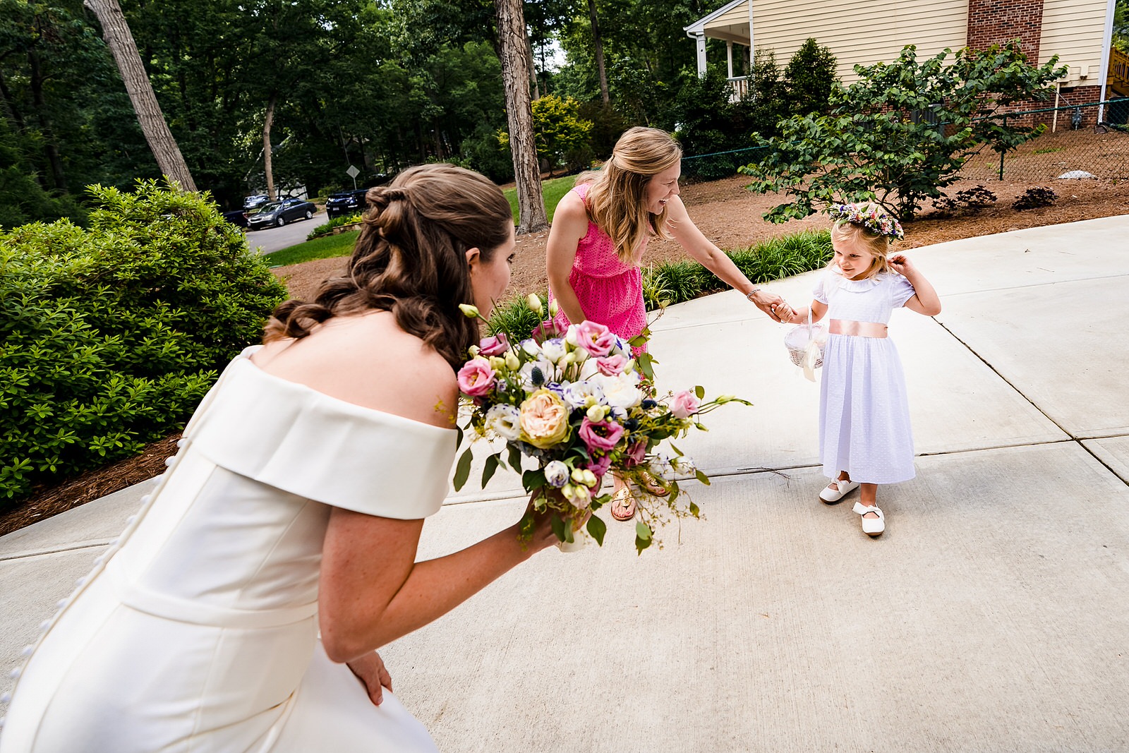 Flower girl nervously greets the bride on the morning of this Raleigh wedding