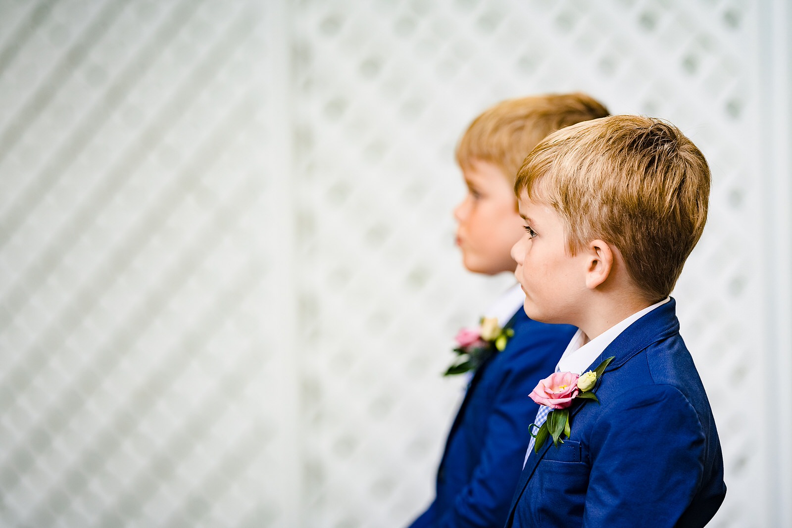 The groom's twin sons look on during the wedding ceremony