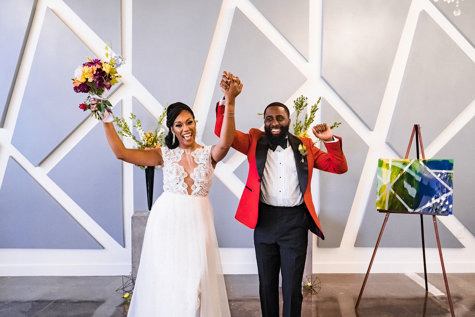 Bride and groom celebrate getting "married" at a colorful wedding inspiration styled shoot