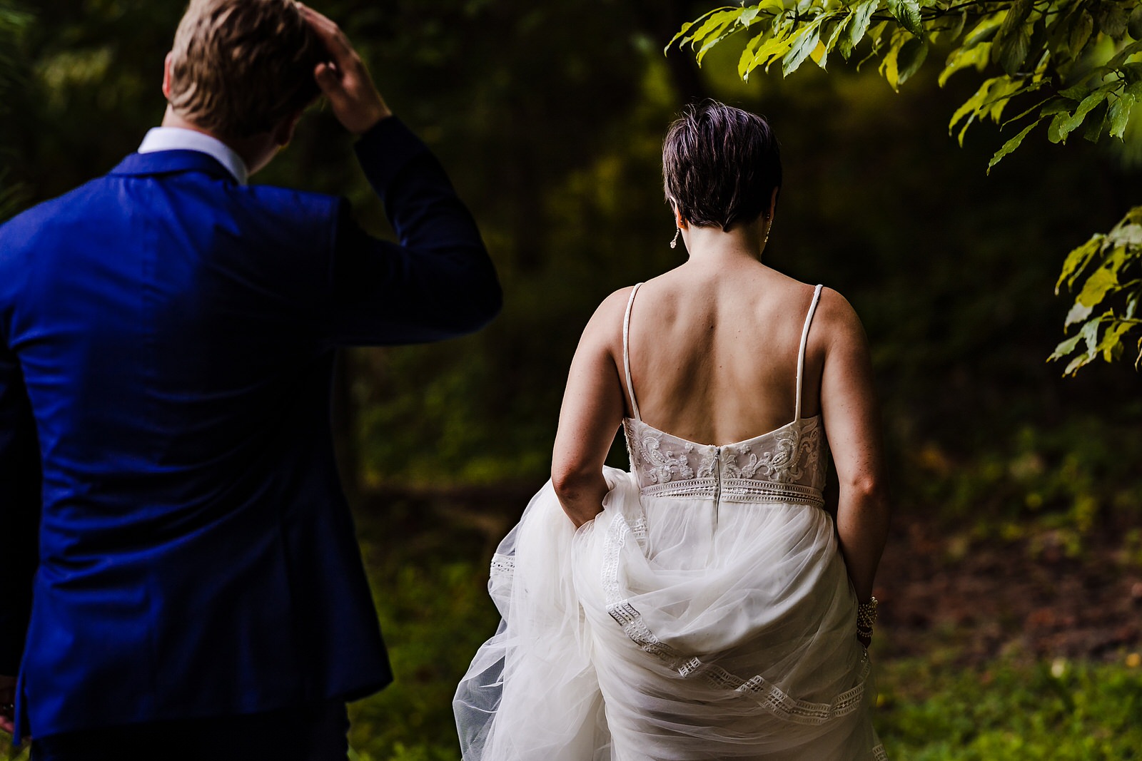 bride and groom walk off into the forest at the end of their Chapel Hill elopement