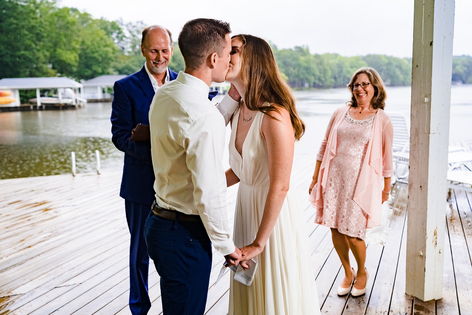 bride and groom share their first kiss at their micro wedding ceremony