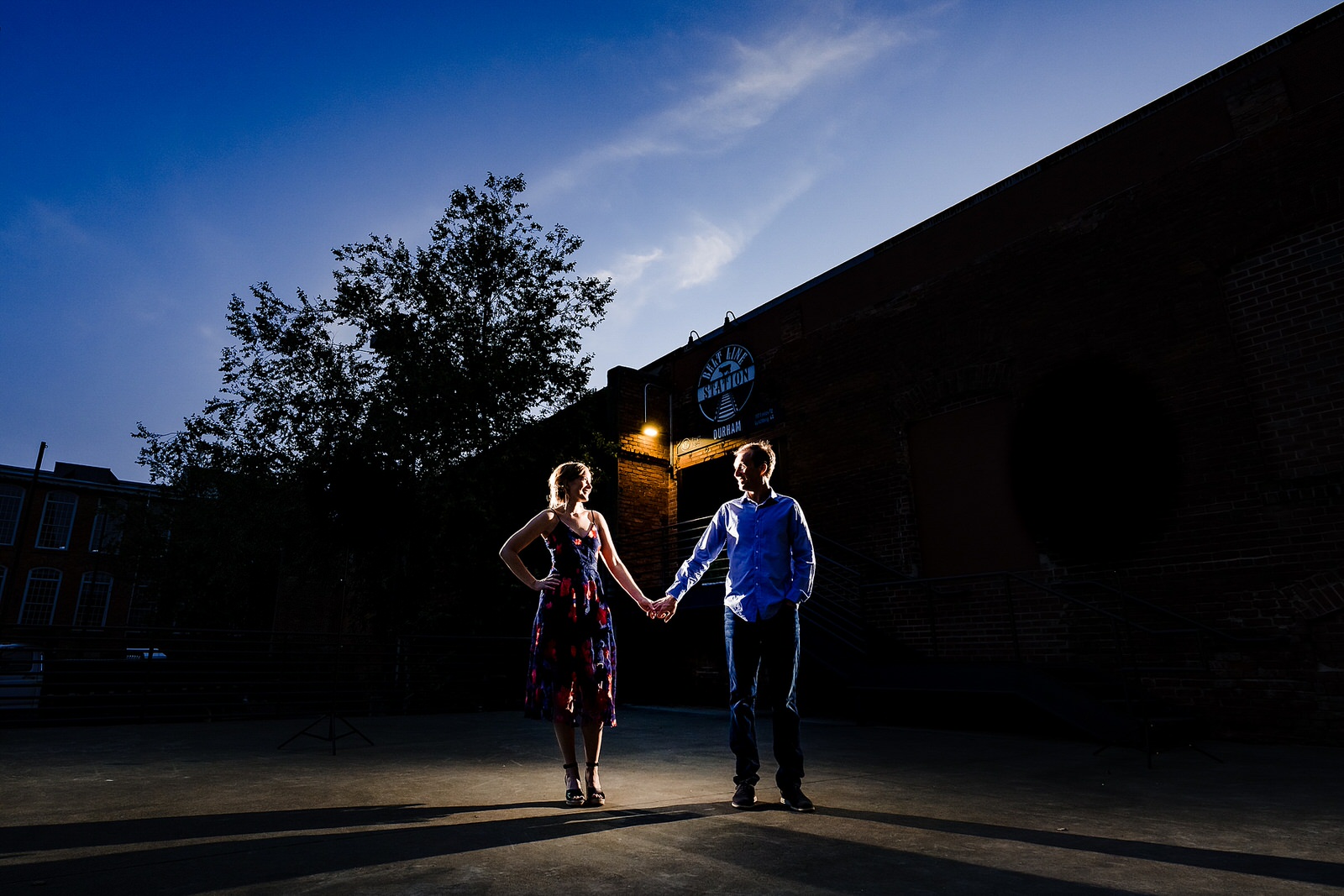 Dramatic and artistic engagement photos at Belt Line Station in Durham, NC