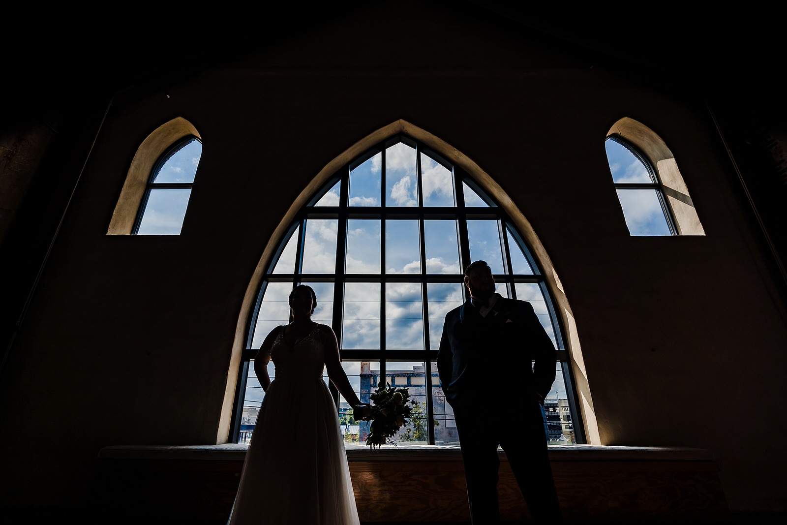 Creative silhouette of a bride and groom on their wedding day at the Brooklyn Arts Center