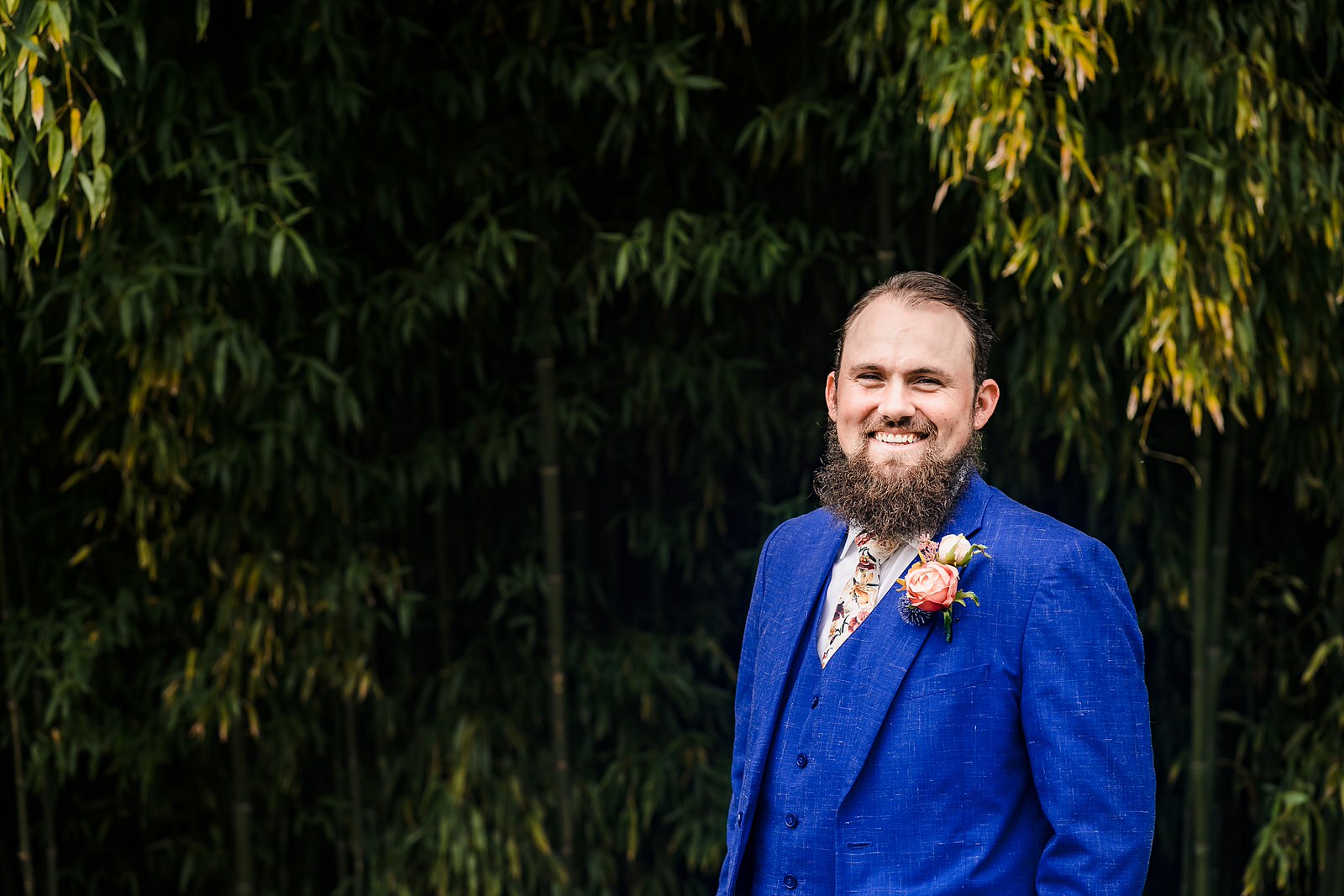 Groom style: blue tux and floral tie from Generation Tux