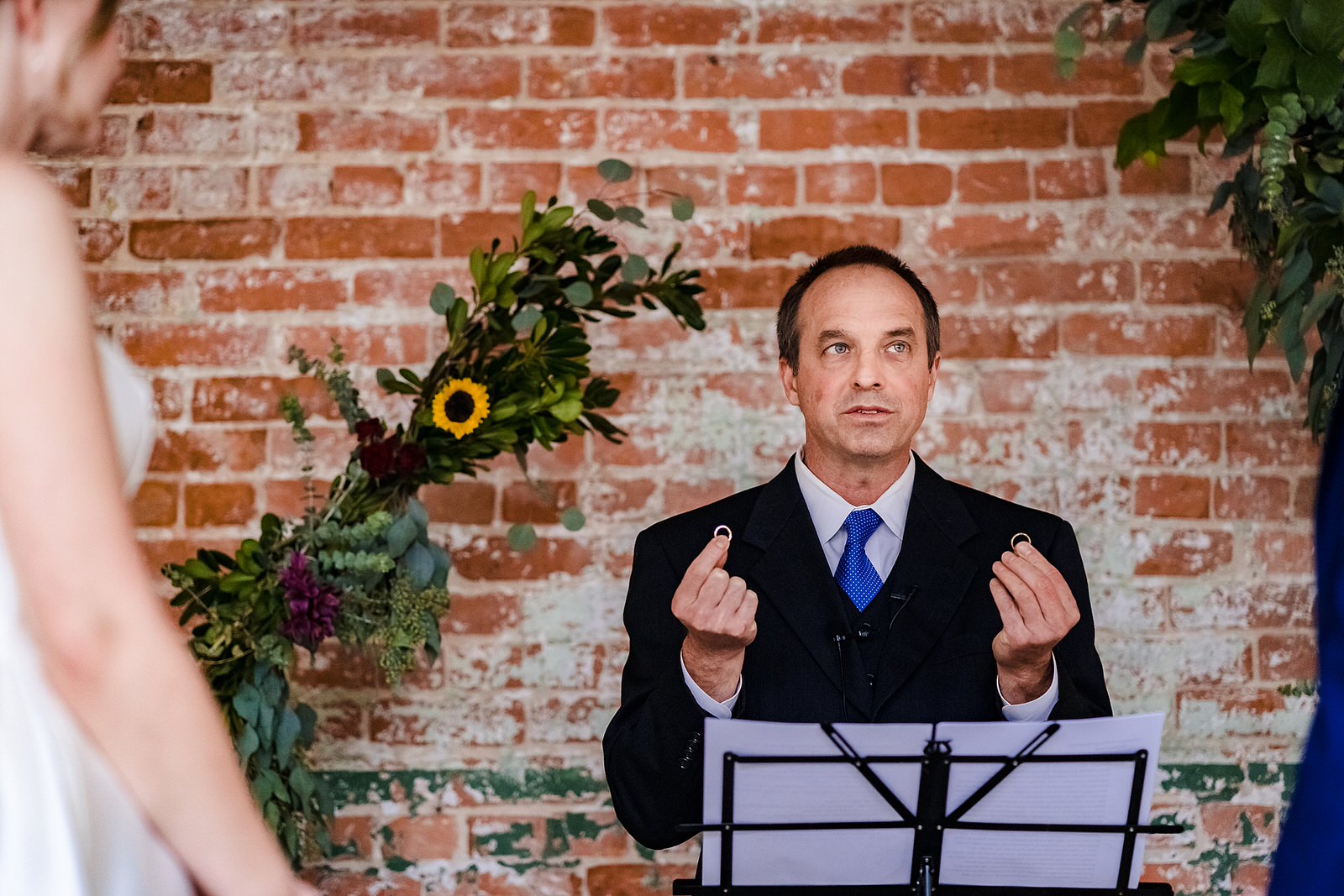 Officiant holds up wedding rings - what do you want your rings to symbolize?