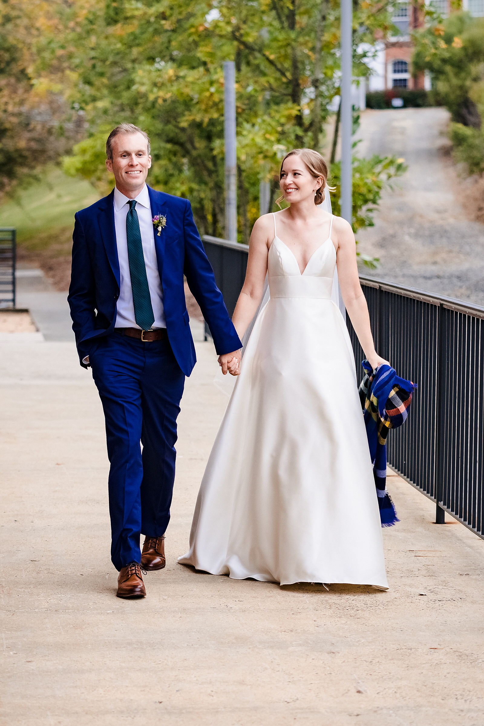 Newlyweds walk back into their wedding cocktail hour