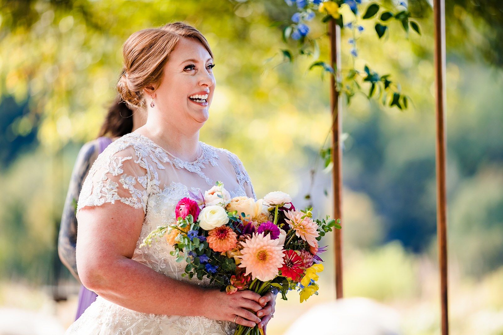 Bride laughs to fight back tears at this emotional wedding ceremony