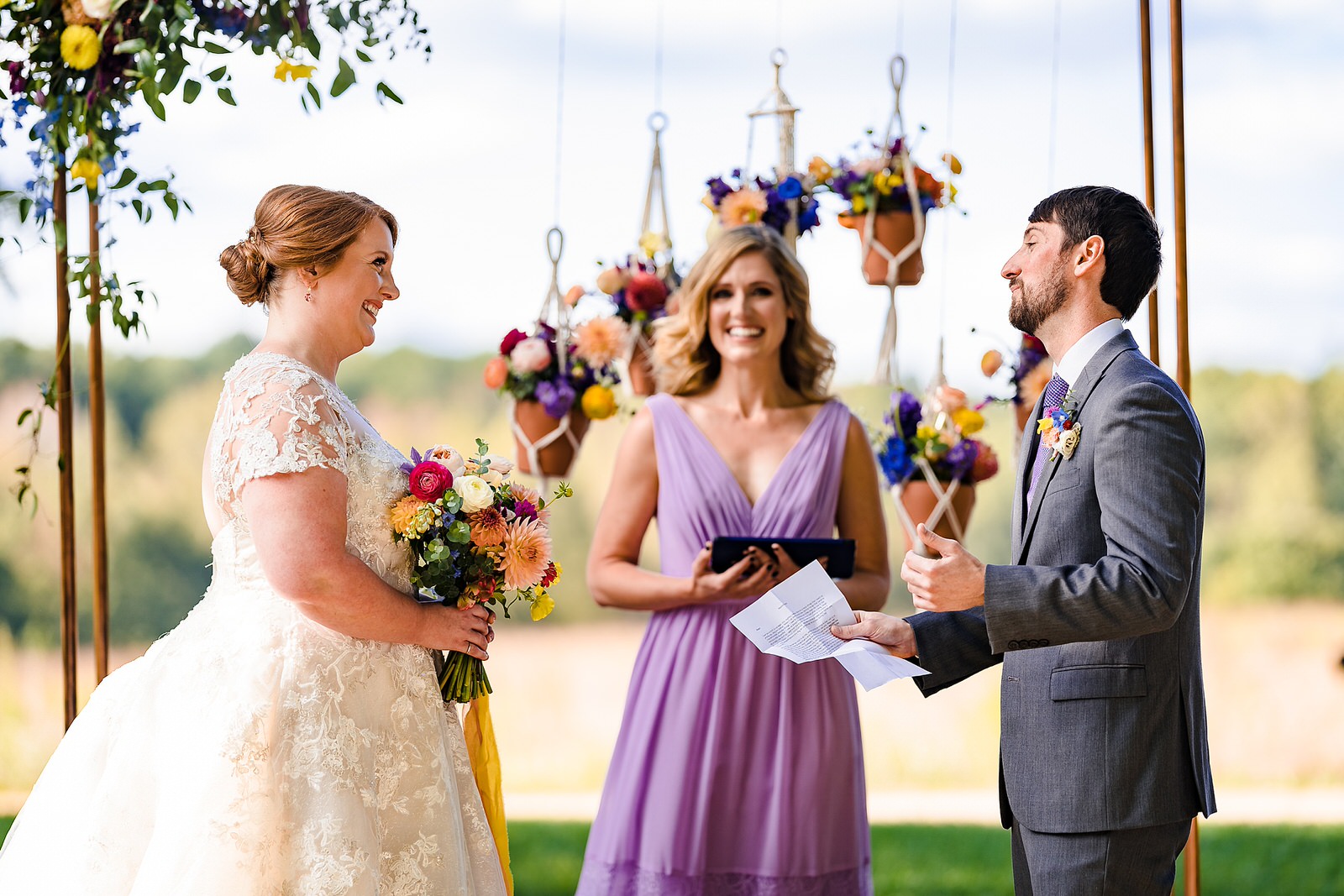 Bride and groom laugh during their personal vows