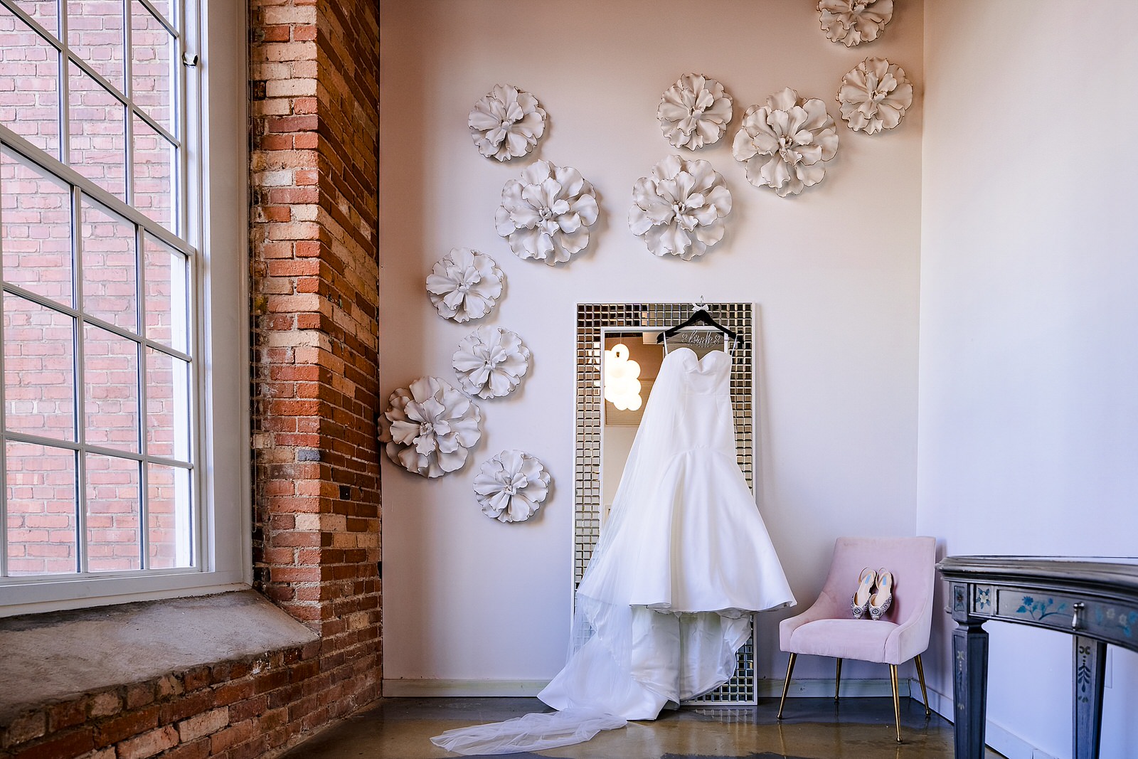The Magnolia Suite at The Cotton Room in Durham, NC has the prettiest room to put your dress on in.