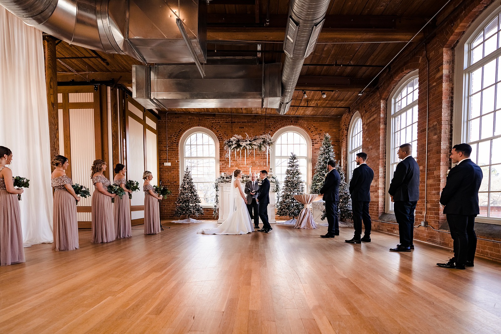The Cotton Room in Durham, NC set up for a Christmas Wedding ceremony