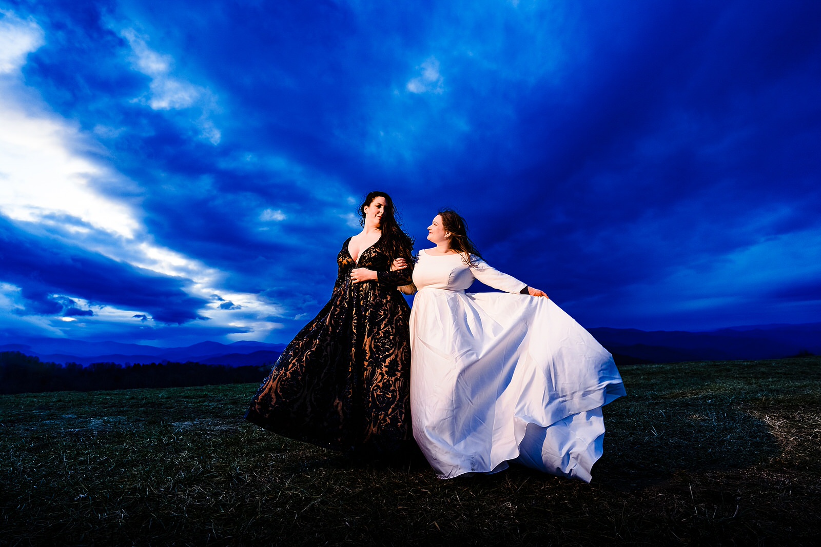 Blue hour wedding portraits with two brides in the NC mountains