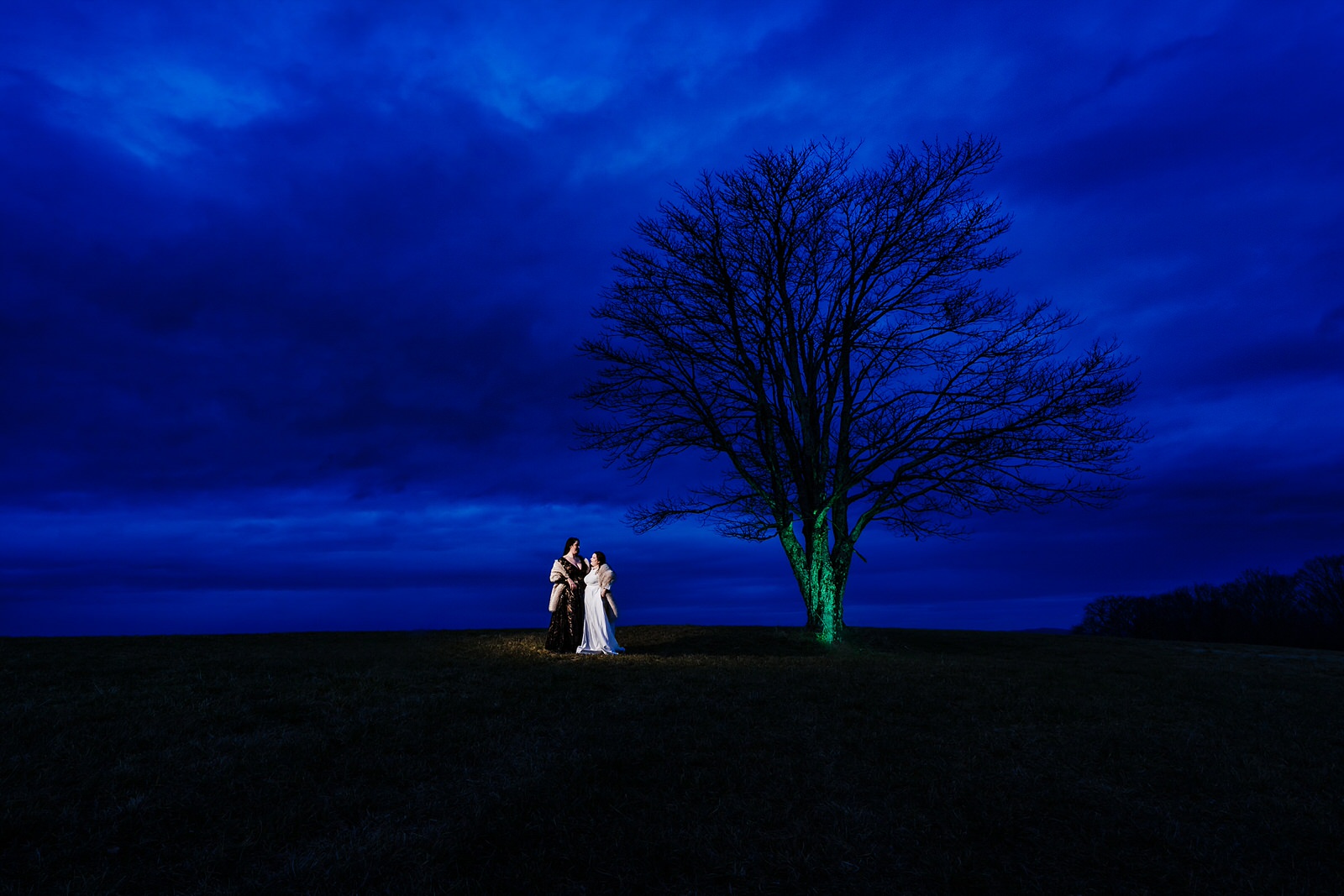 Blue hour wedding portraits with two brides in the NC mountains
