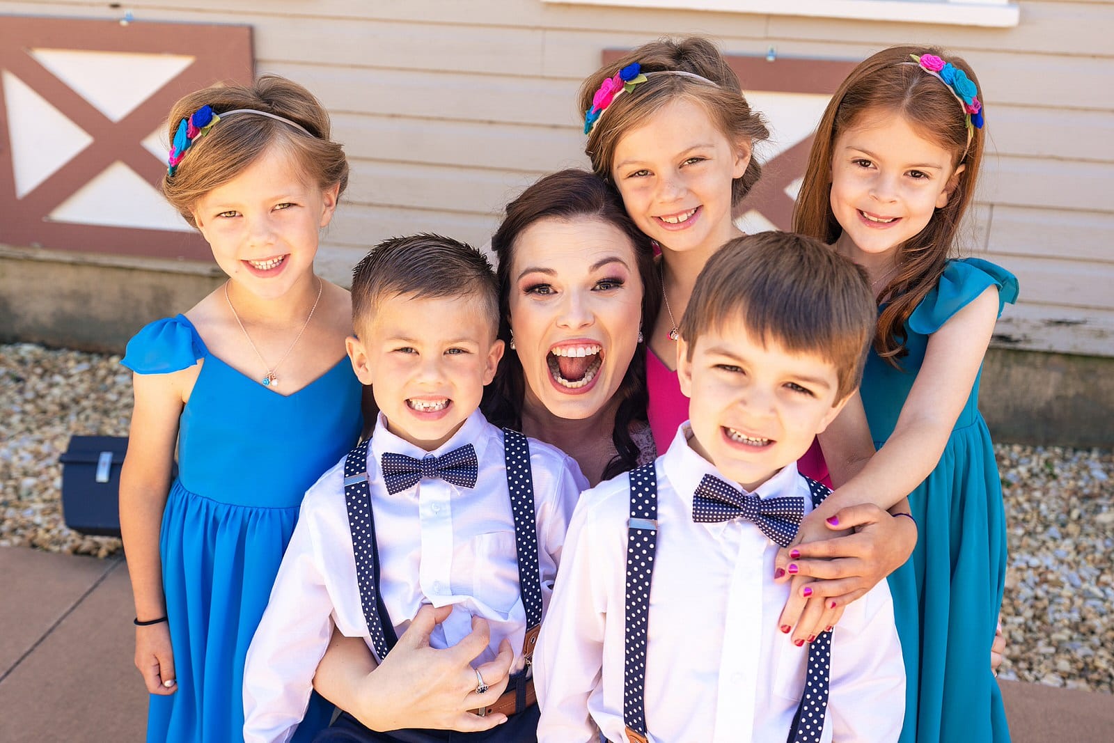 Bride with her flower girls and ring bearers
