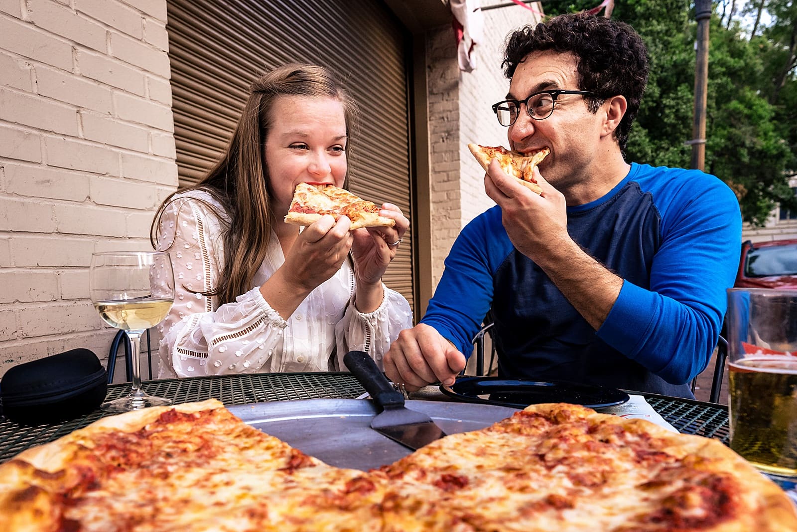 Have fun with your engagement photos - eat pizza and toast one another. 