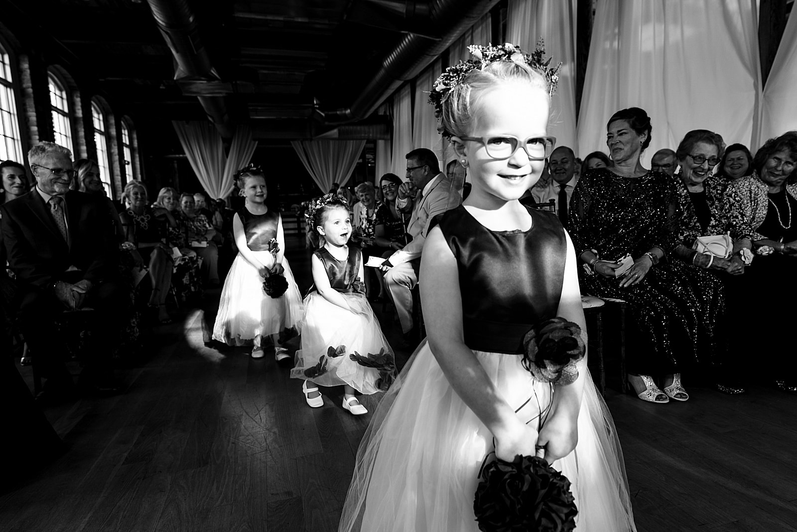 Flower girls process down the aisle