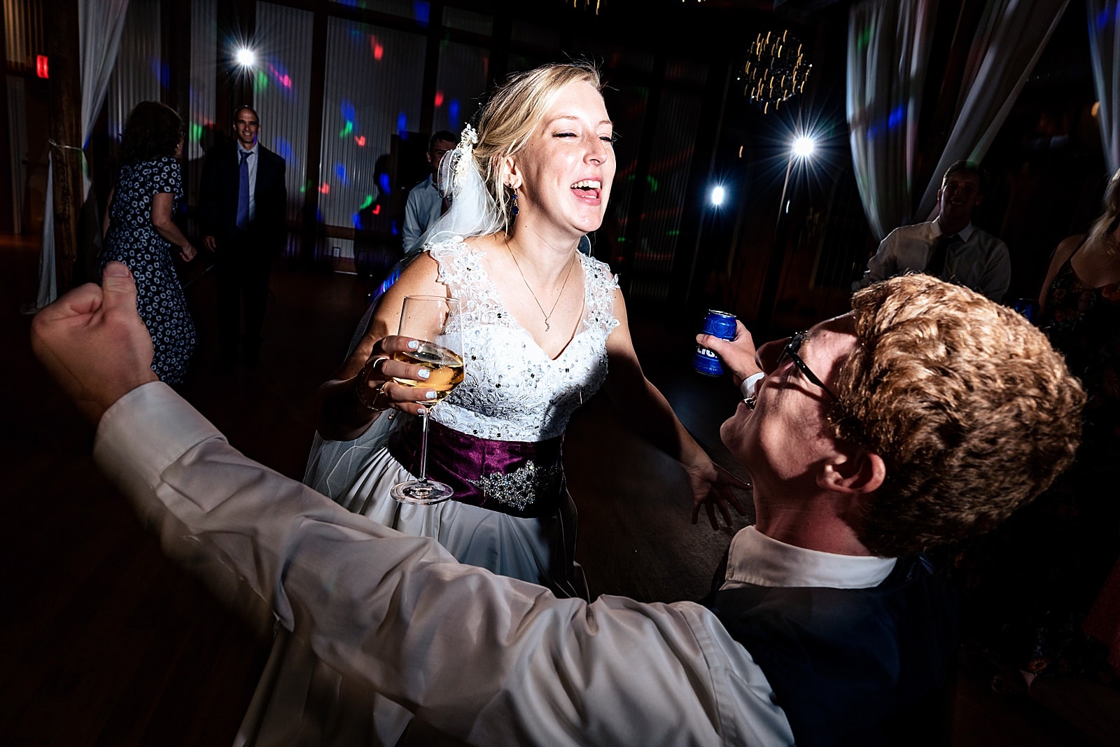 Bride and groom sing and dance at their fun wedding in Durham, NC 