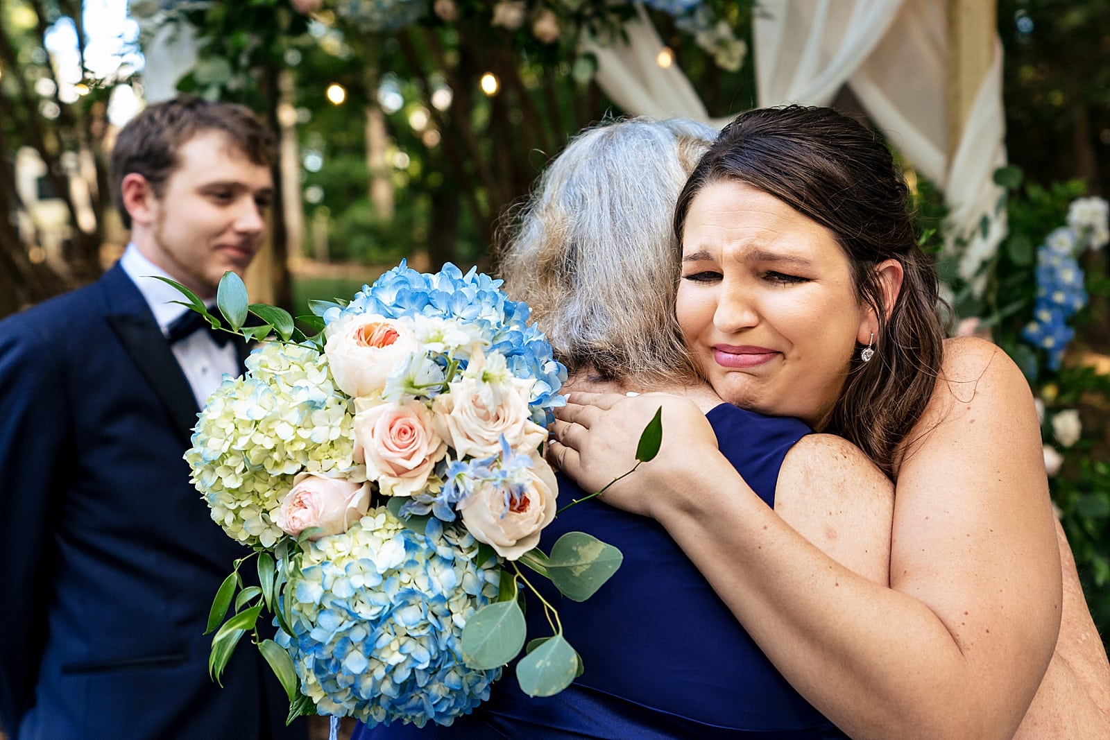 This bride's mother walked her down the aisle and they shared a beautiful, emotional hug 