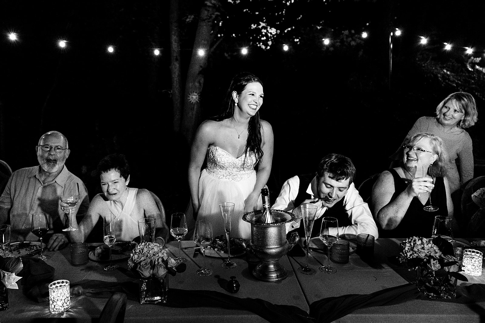 If you're having an al fresco wedding reception, make sure you get a photographer who knows how to light up the dark