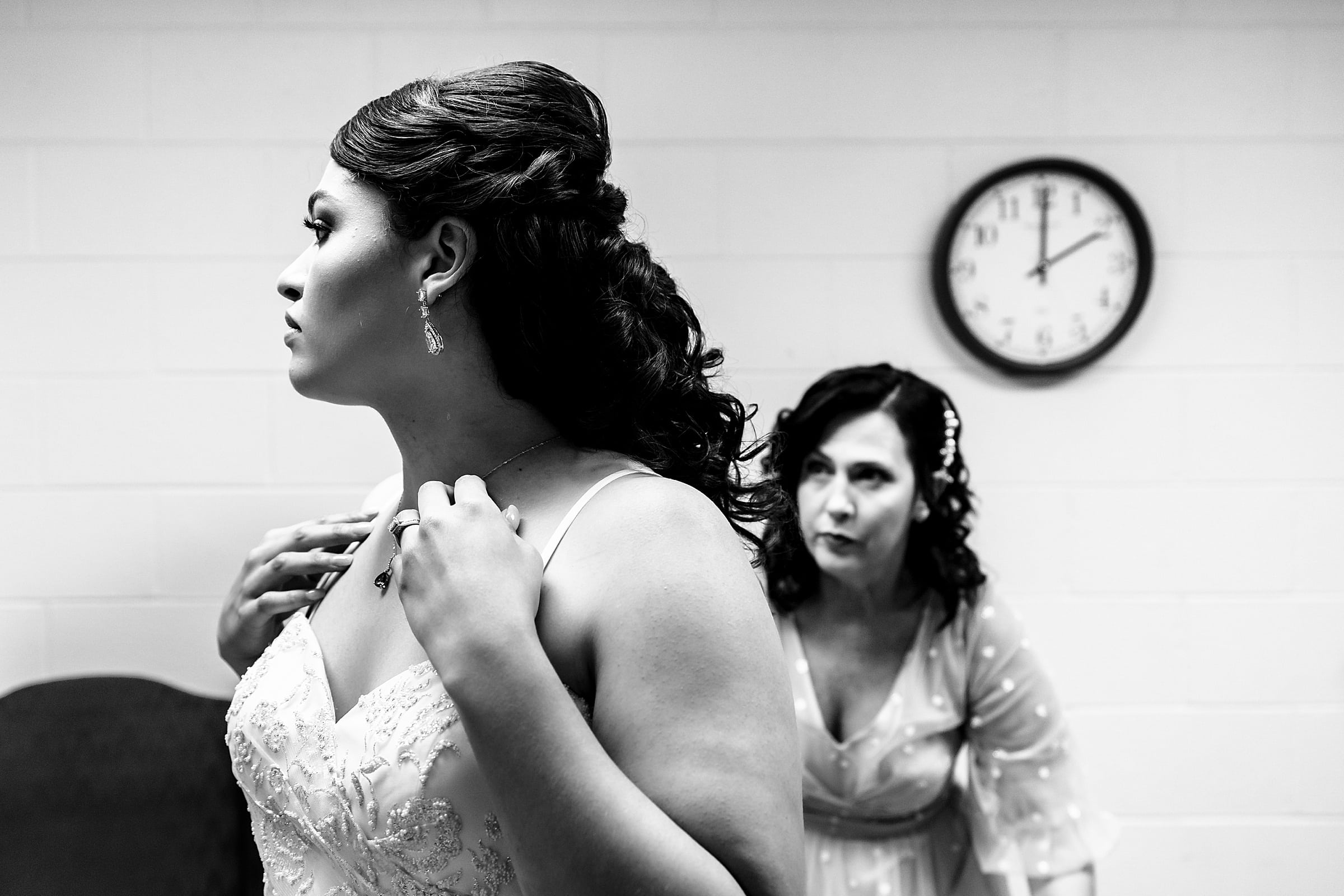 Bride's mother helps her with the finishing touches| photos by Kivus & Camera