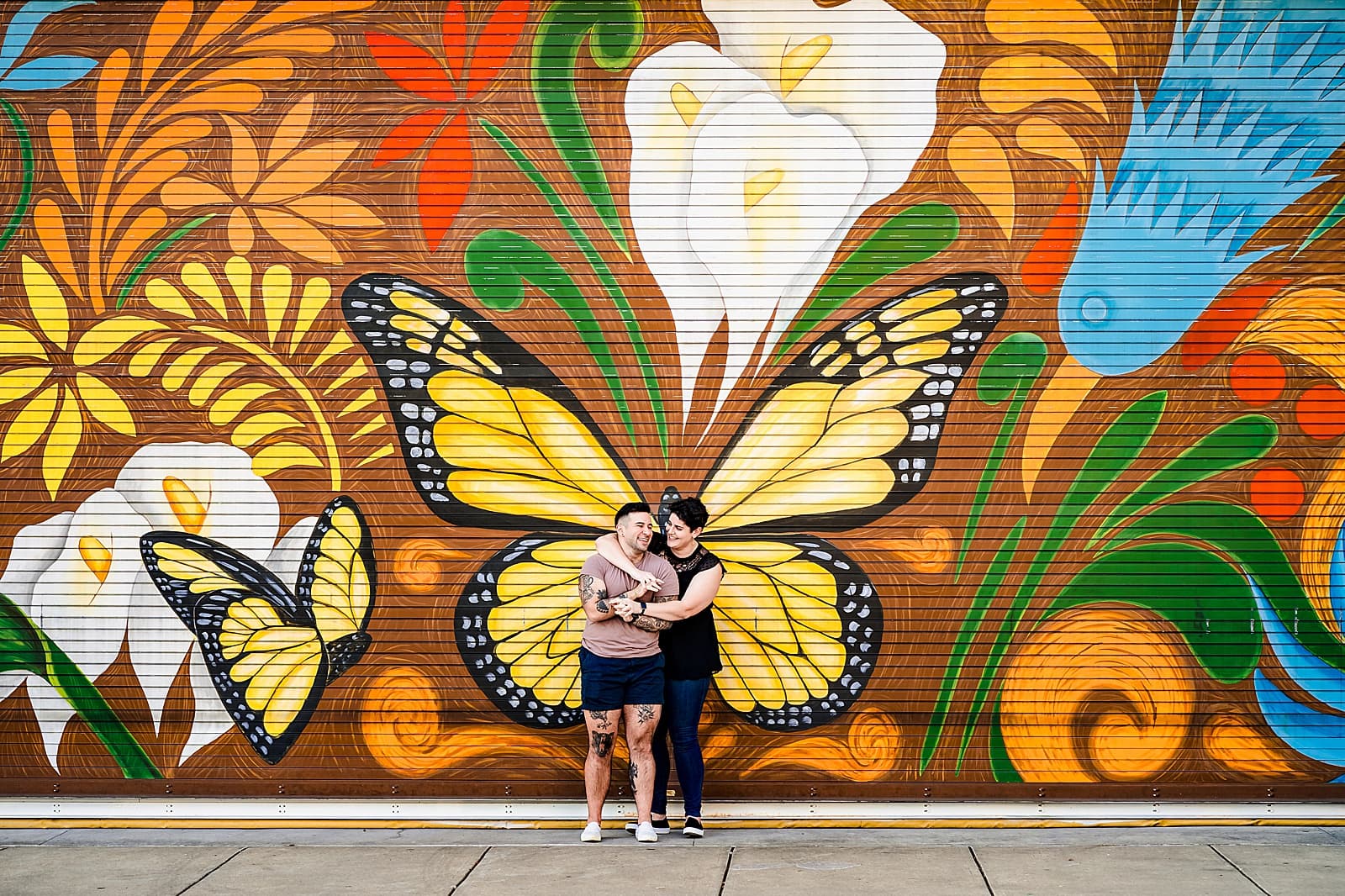 Engagement photos in front of Durham murals