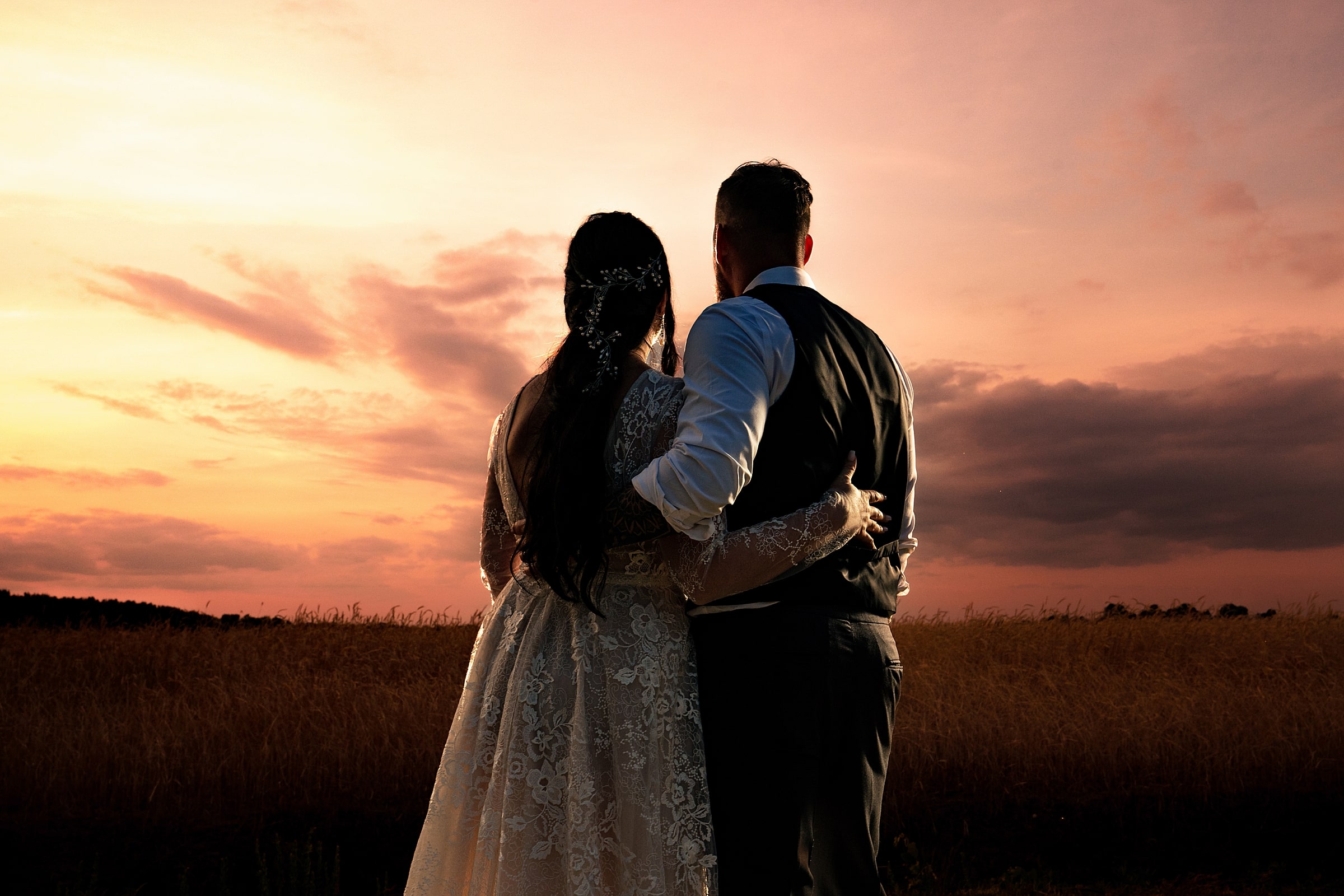 newlyweds watch the sunset during their wedding day in North Carolina