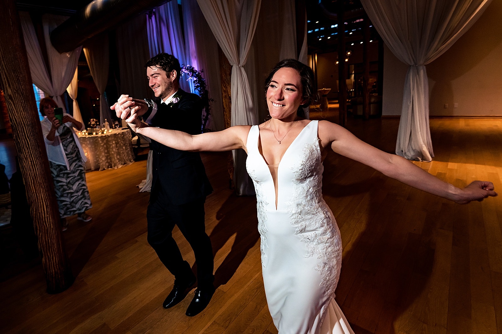 newlyweds make their entrance at this downtown durham wedding at The Cotton Room | images by Kivus & Camera