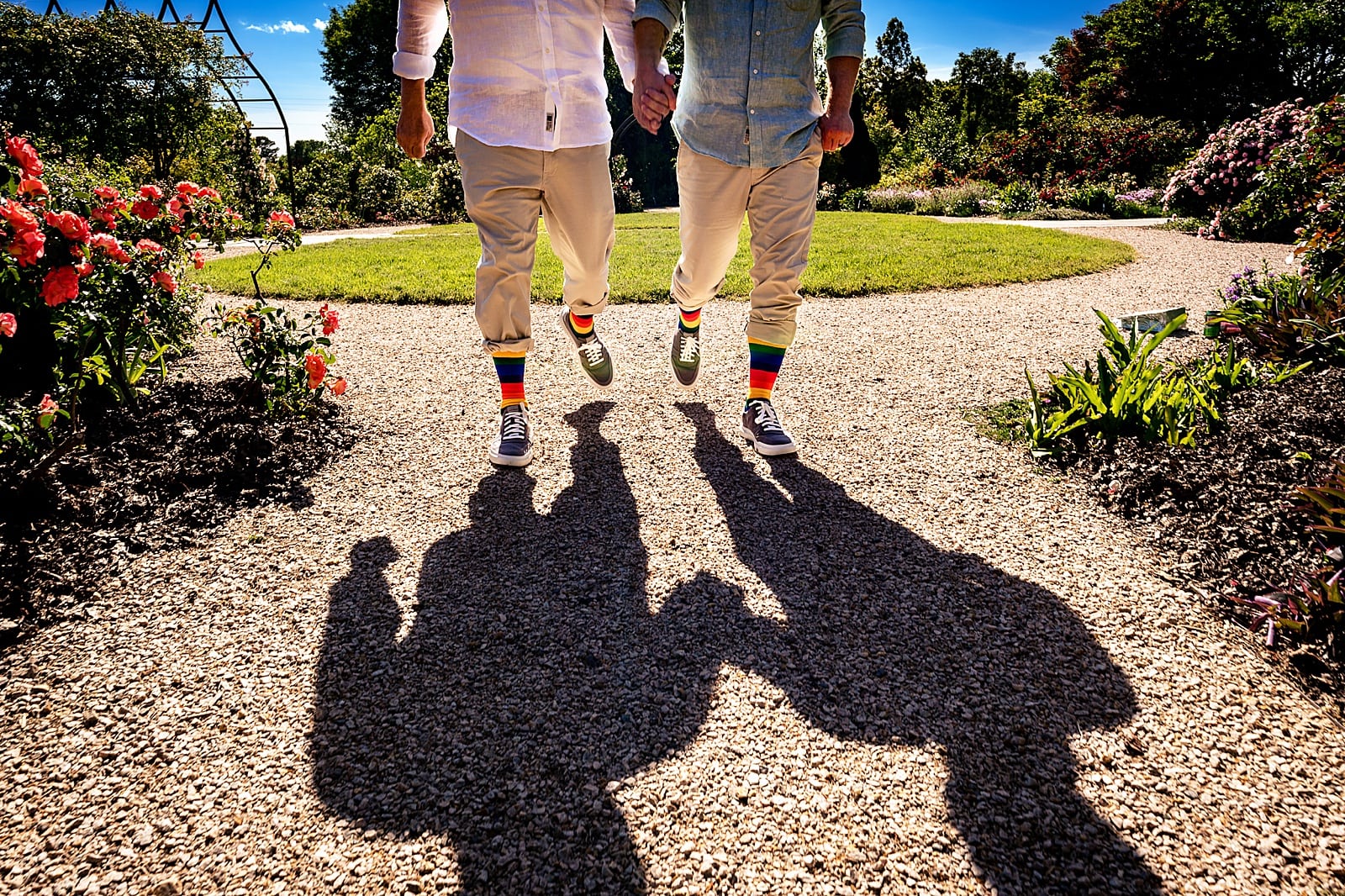 Portrait of two grooms' rainbow socks and their shadows at their Raleigh LGBTQ wedding | Raleigh LGBTQ wedding photographer