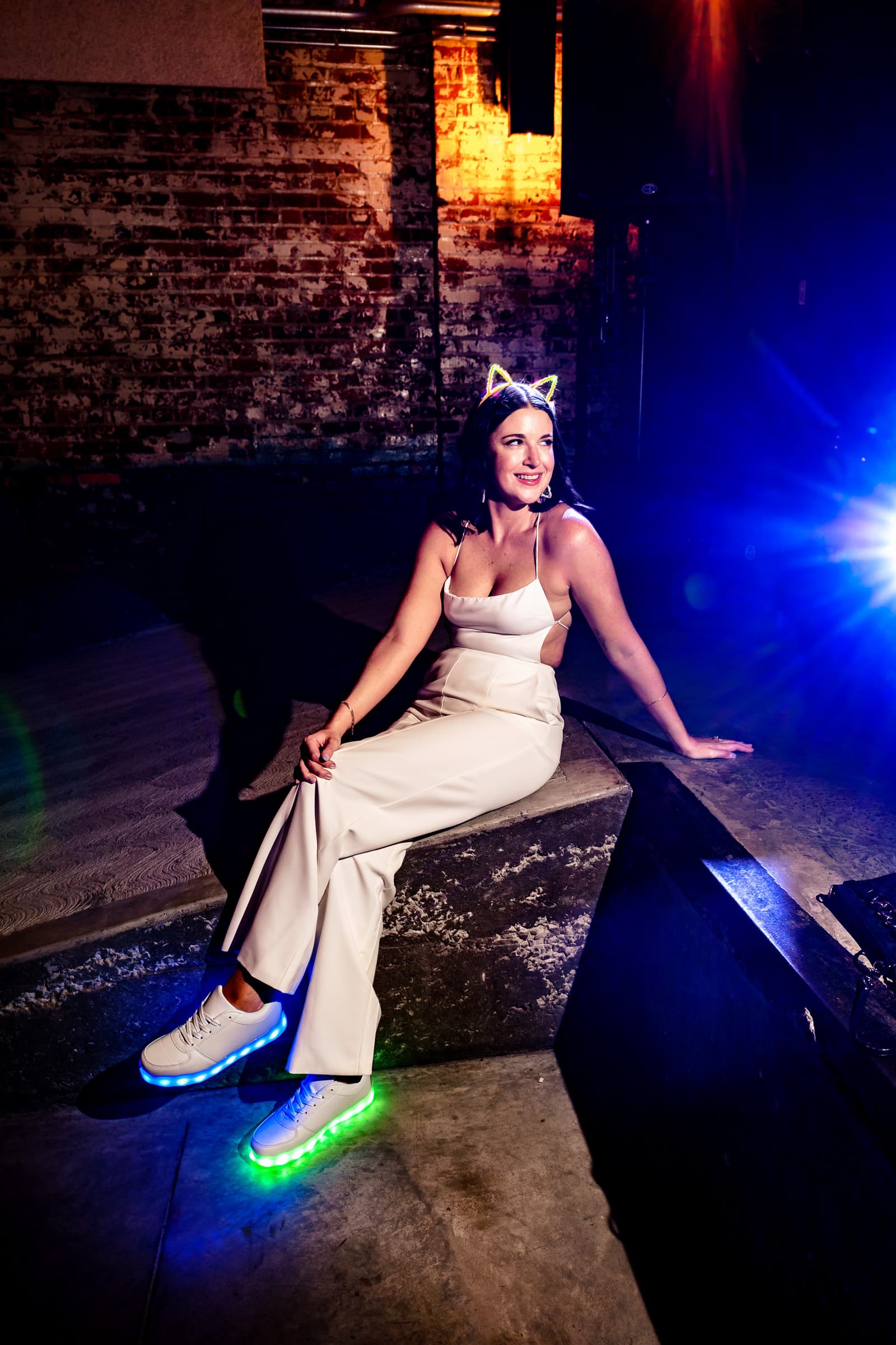This bride changed into a white jumpsuit and light up sneakers for part of her wedding reception | photos by Kivus & Camera