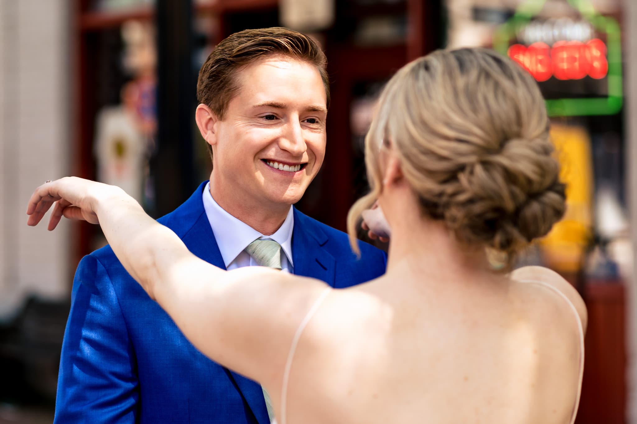 groom's reaction to bride at first look at The Grove at City Market | photo by Kivus & Camera