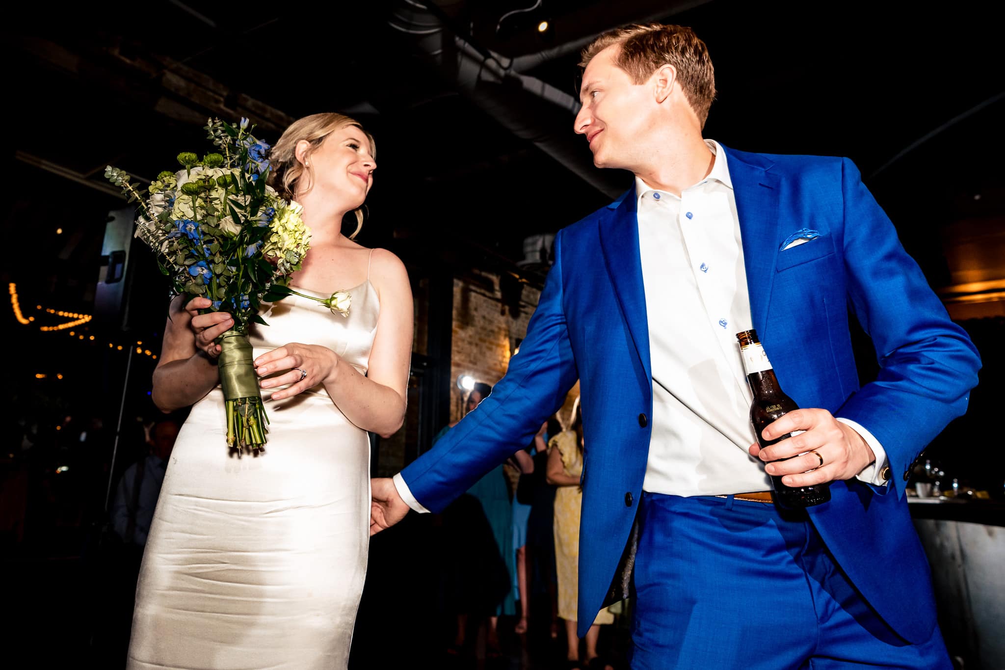 hilarious bouquet toss at The Grove at City Market | photo by Kivus & Camera