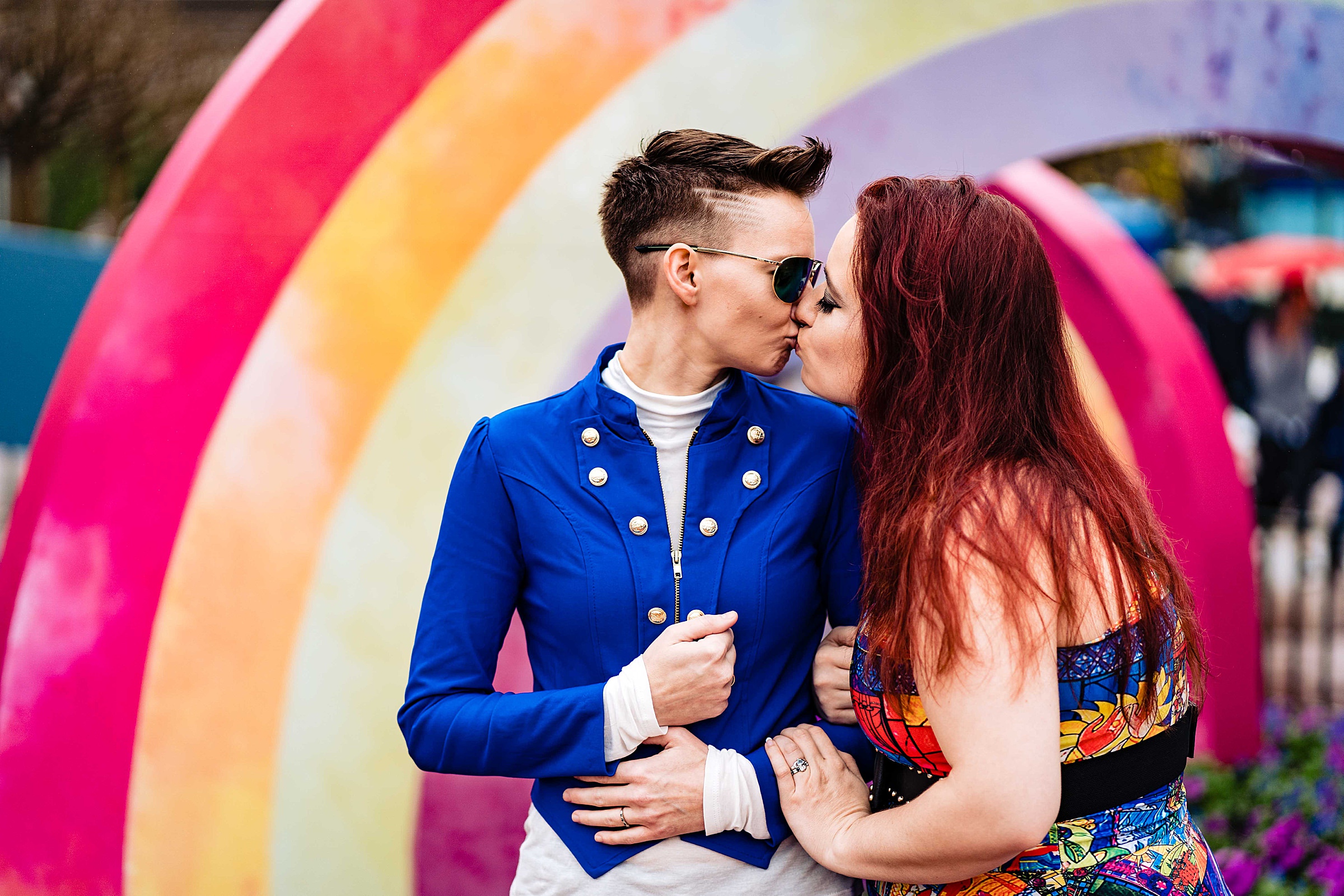 Same-sex couple kissing in front of rainbow at Epcot | Disney engagement, disney engagement photos, Disney portraits, epcot engagement photos, kivusandcamera.com, magic kingdom engagement photos, same-sex engagement photos, Walt Disney World engagement