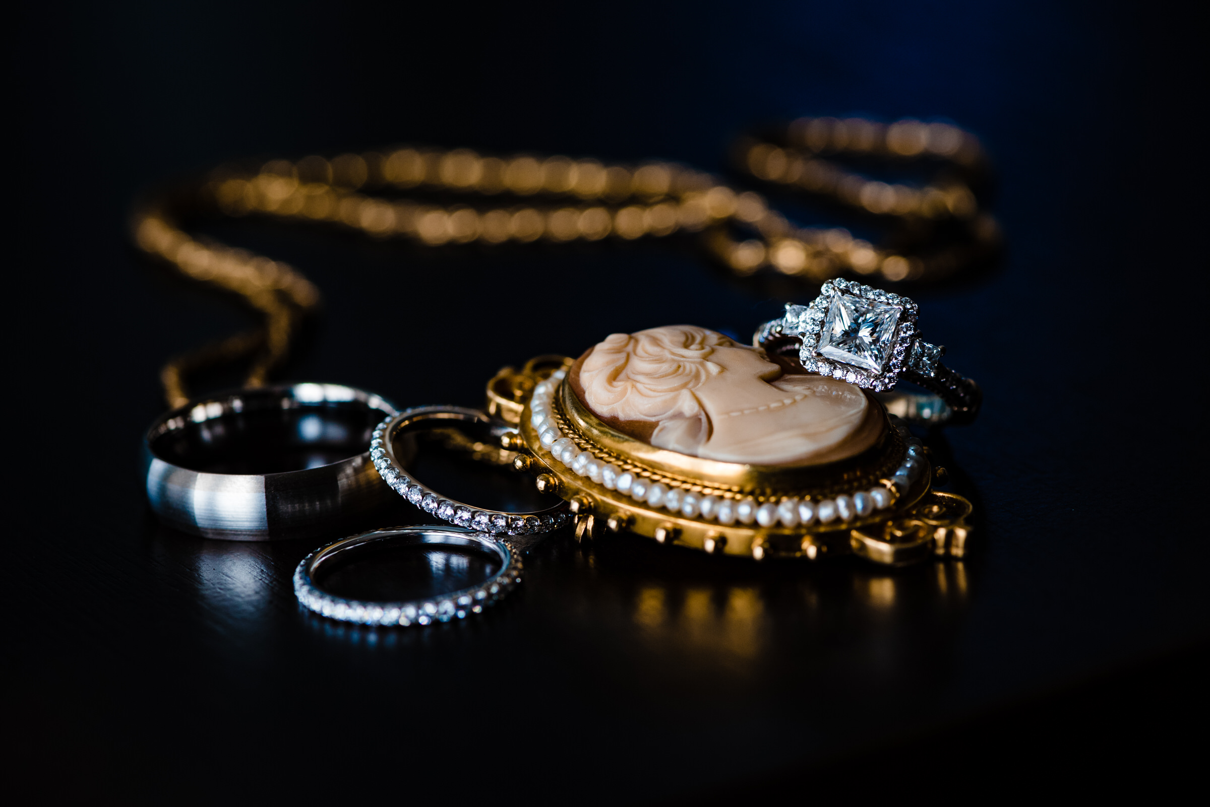 photograph of wedding rings along with the bride's heirloom jewelry by Raleigh Wedding Photographers