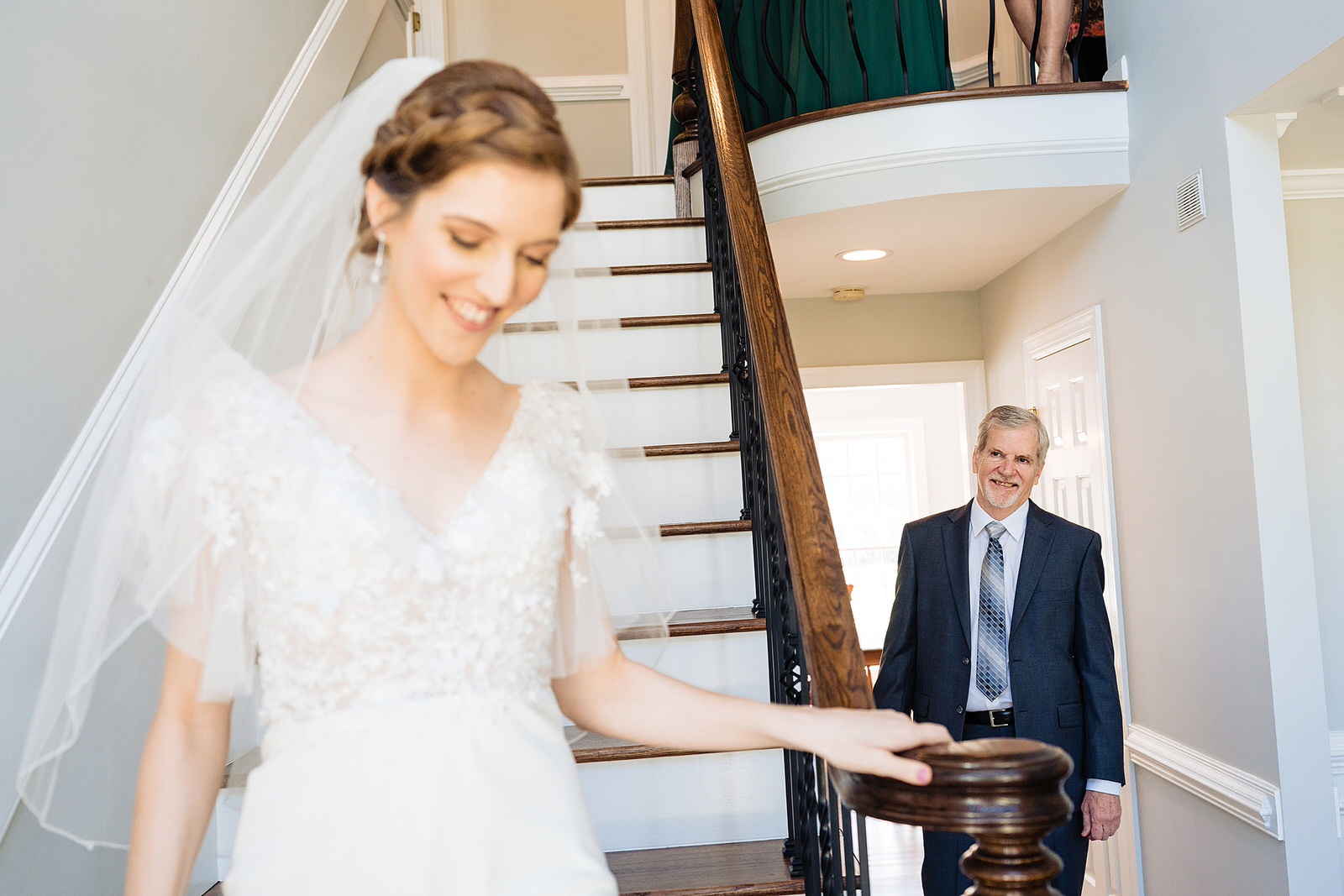 Bride descends staircase to see her father for the first time on her wedding day at The Meadows Raleigh