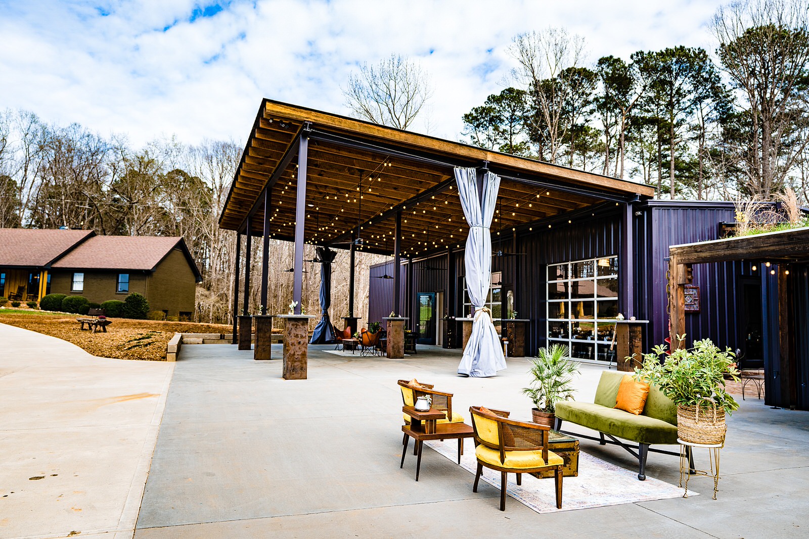 Heron Hall at the Meadows Raleigh set up with outdoor lounges for a wedding at The Meadows Raleigh