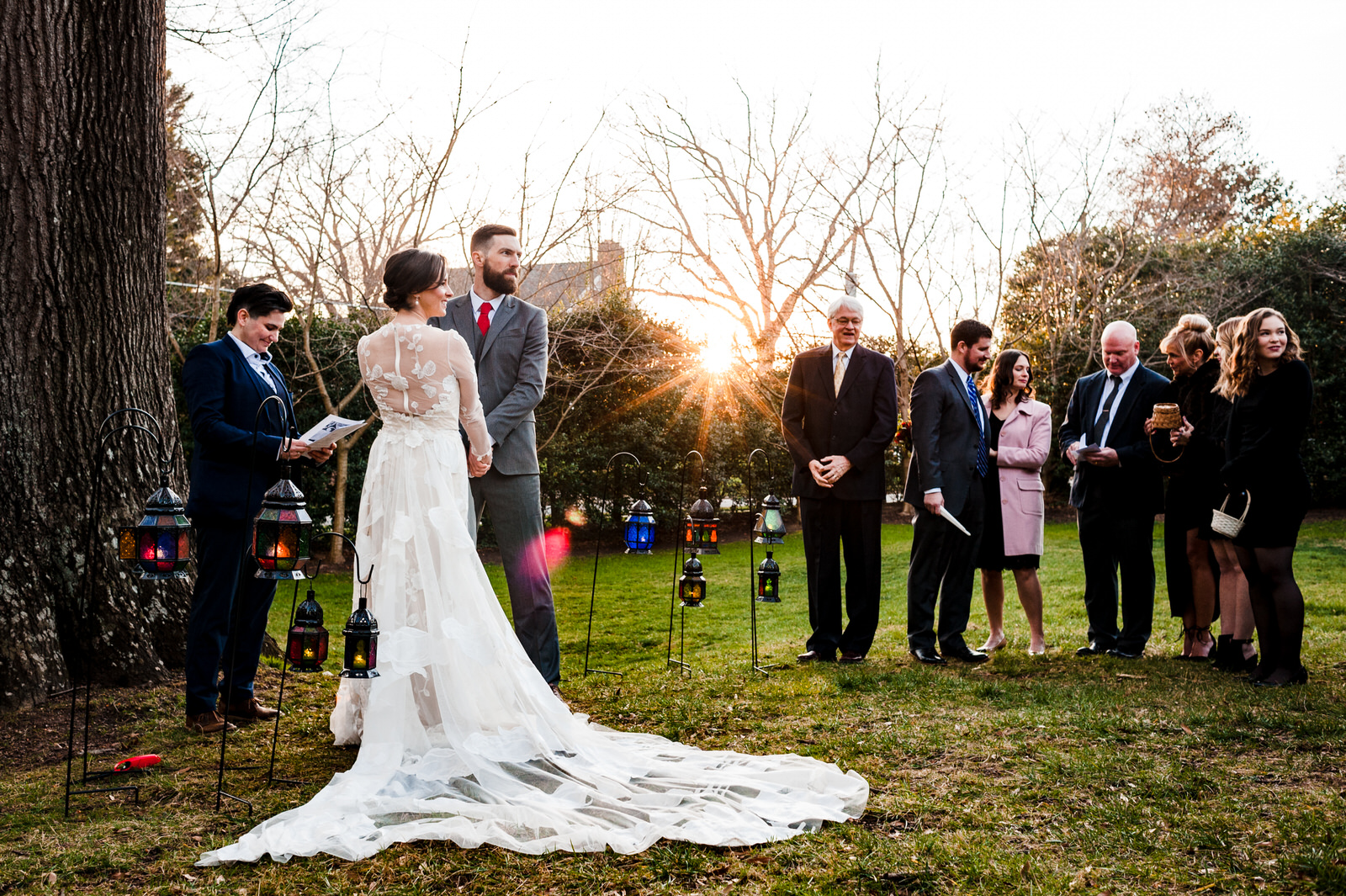 Bride and groom look out at their guests at an intimate micro-wedding in Raleigh, NC