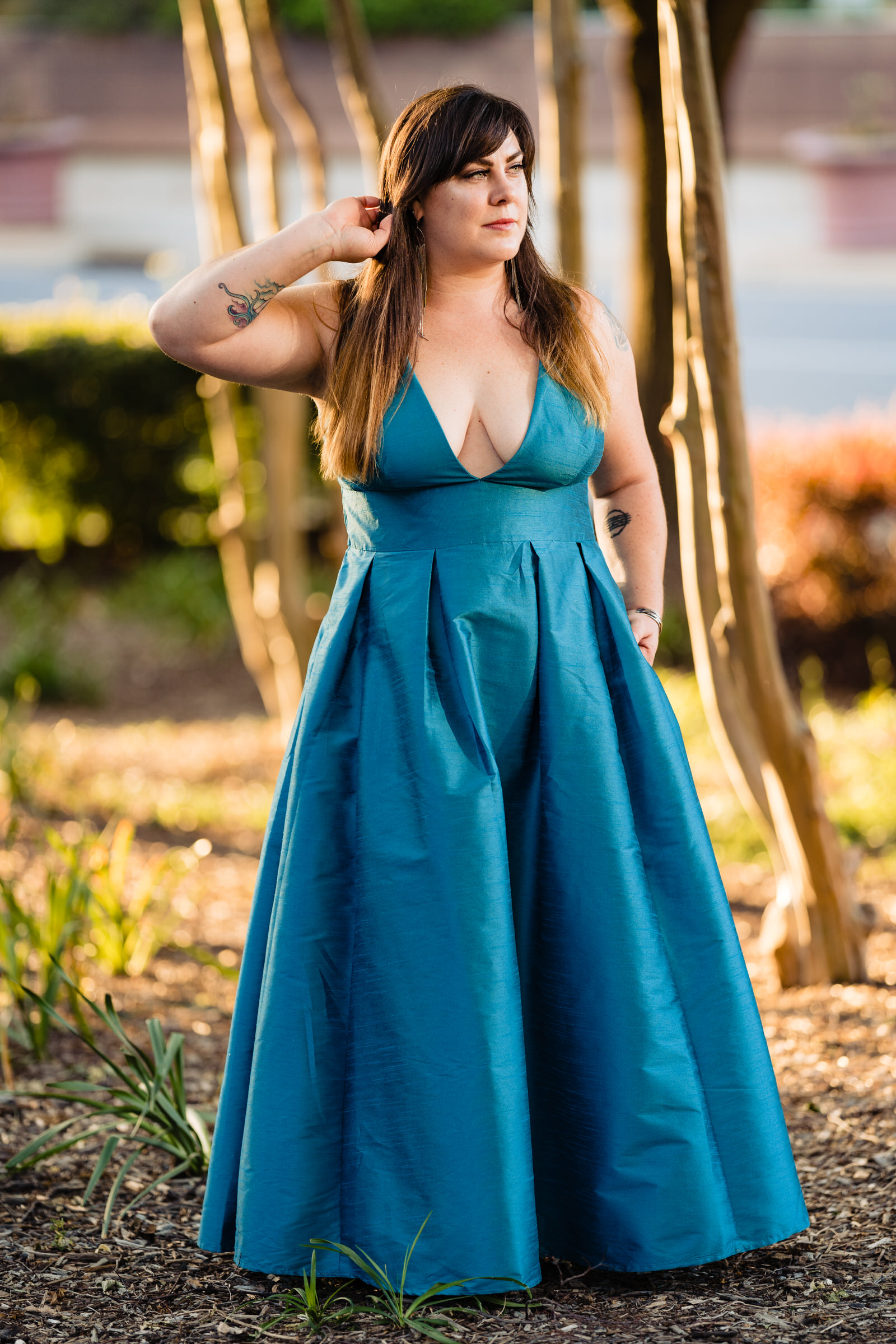 Woman in a teal dress in golden light