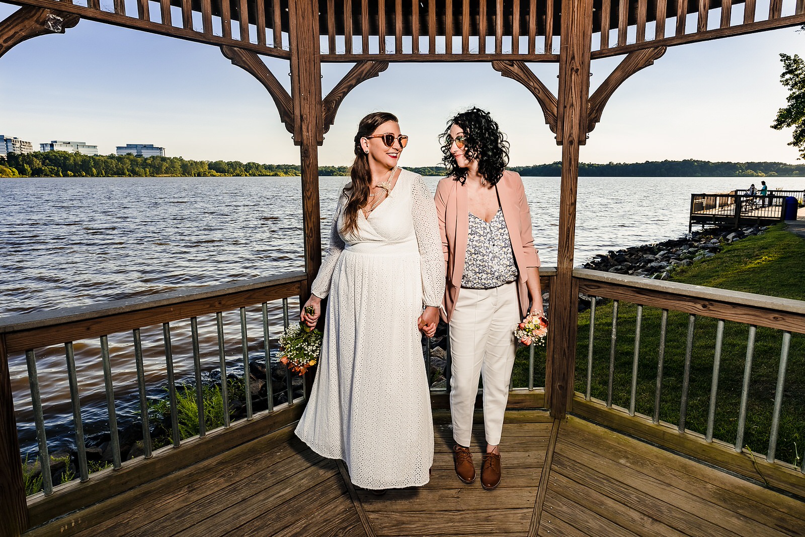 Two brides strike a fun pose at their same-sex elopement in Raleigh, NC