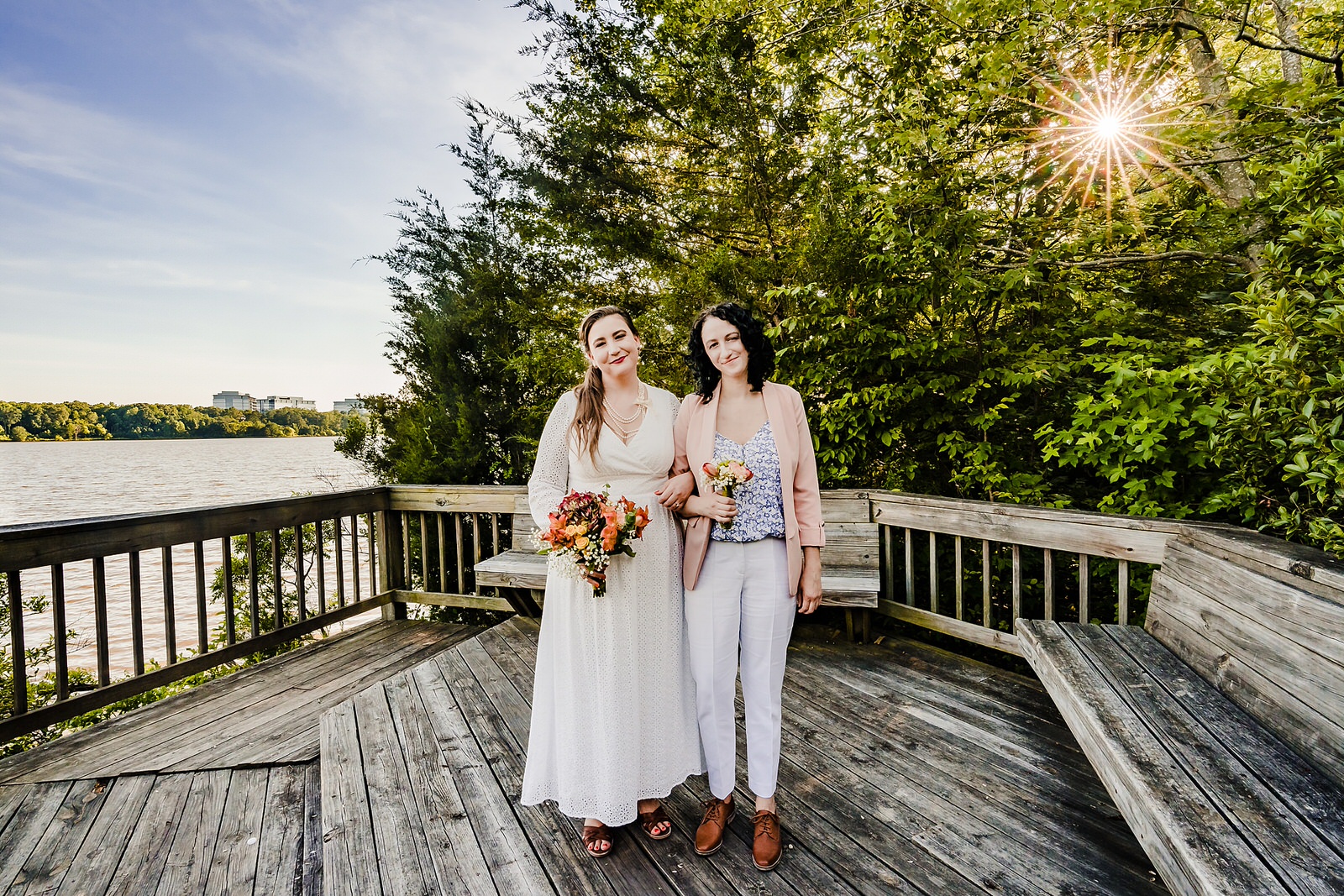 Portrait of two brides at their wedding ceremony location