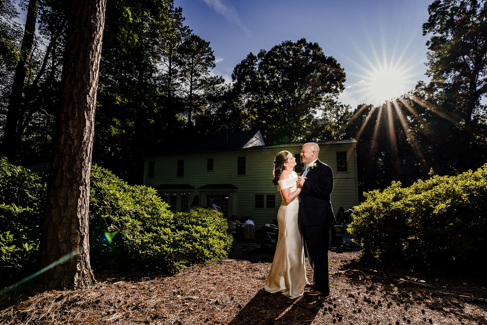 Dramatic wedding day portraits of bride and groom after their backyard ceremony