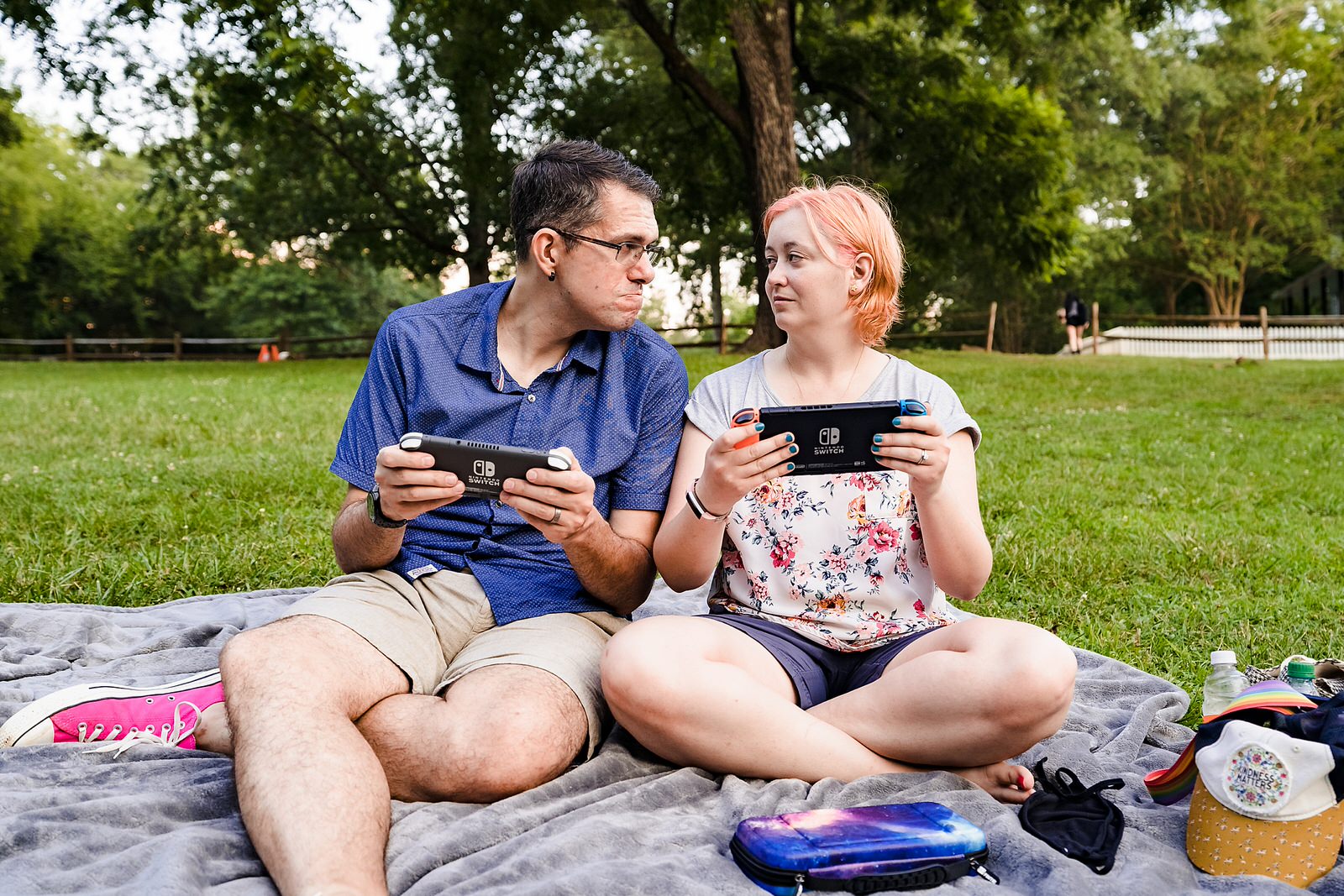 Engaged couple plays Nintendo Switch during their nerdy engagement photos
