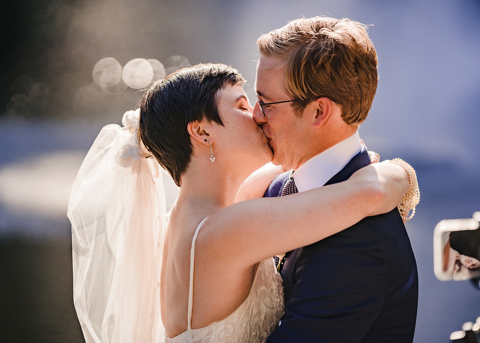 Bride and groom share their first kiss during a Chapel Hill elopement