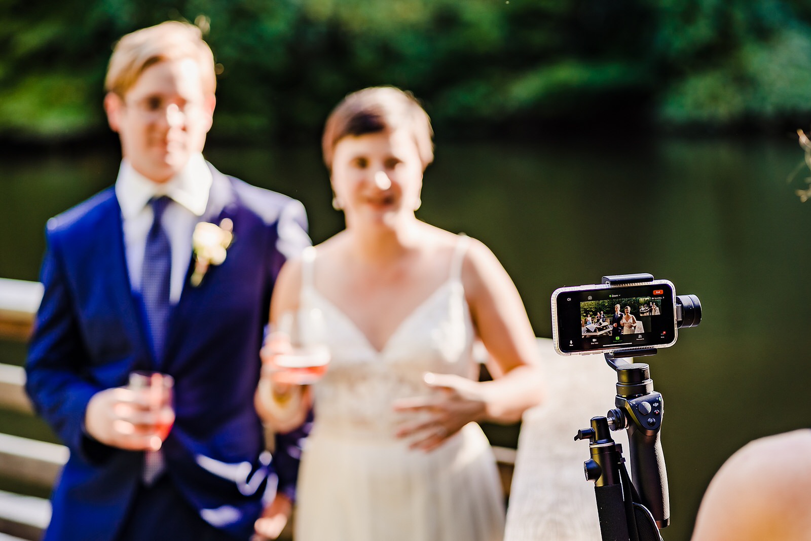 wedding couple speaks to their guests who are in attendance via zoom at a Covid19 wedding
