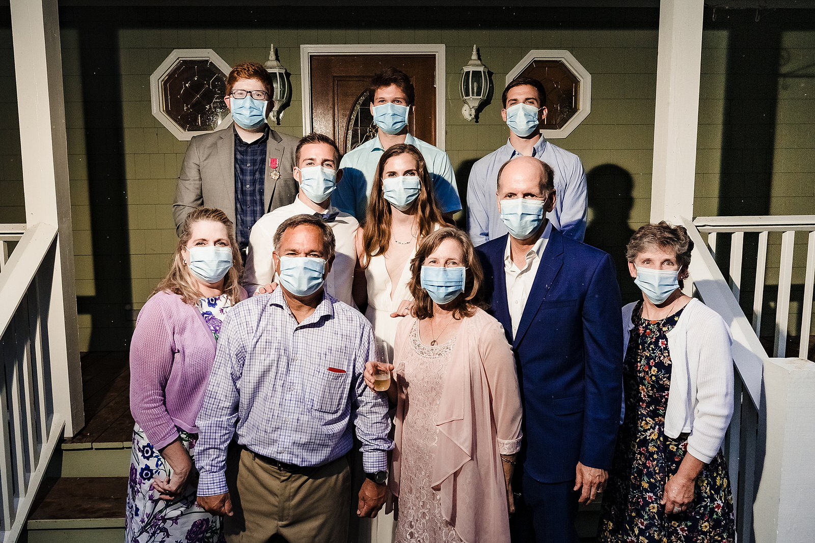 wedding couple and guests pose with masks on during covid19 micro wedding