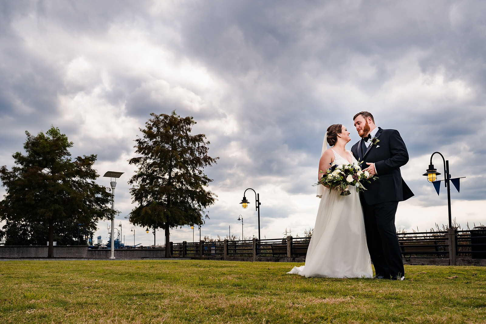 Bride and Groom pose at the Wilmington River Walk after their wedding at the Brooklyn Arts Center