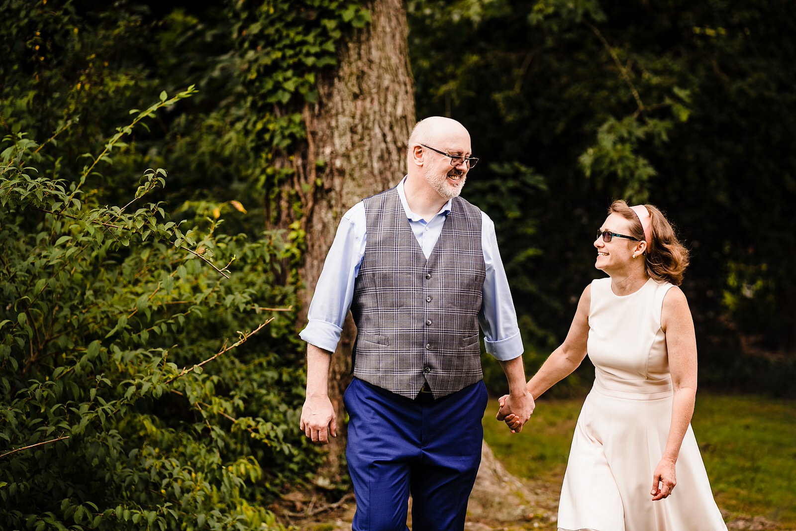An older couple holds hands on their wedding day - inspiration for a casual backyard wedding