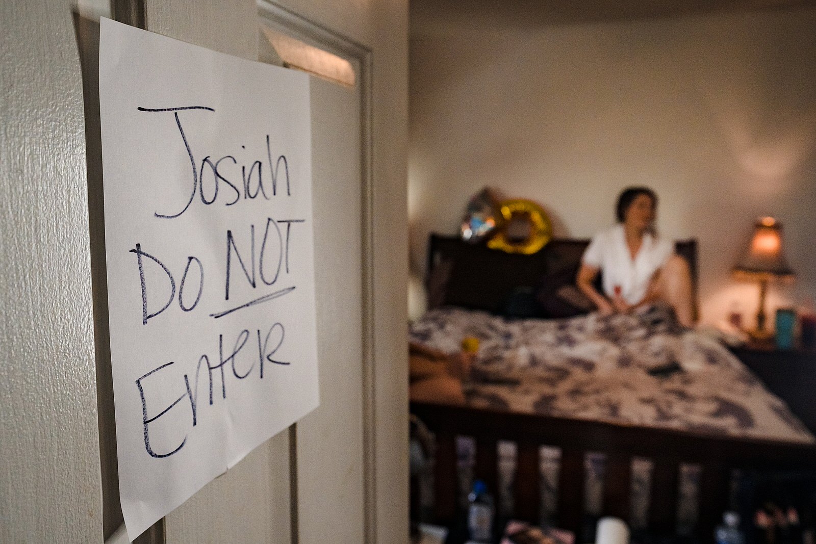 This bride put a sign on the door of the room that she was getting ready in that made it clear the groom could not come in